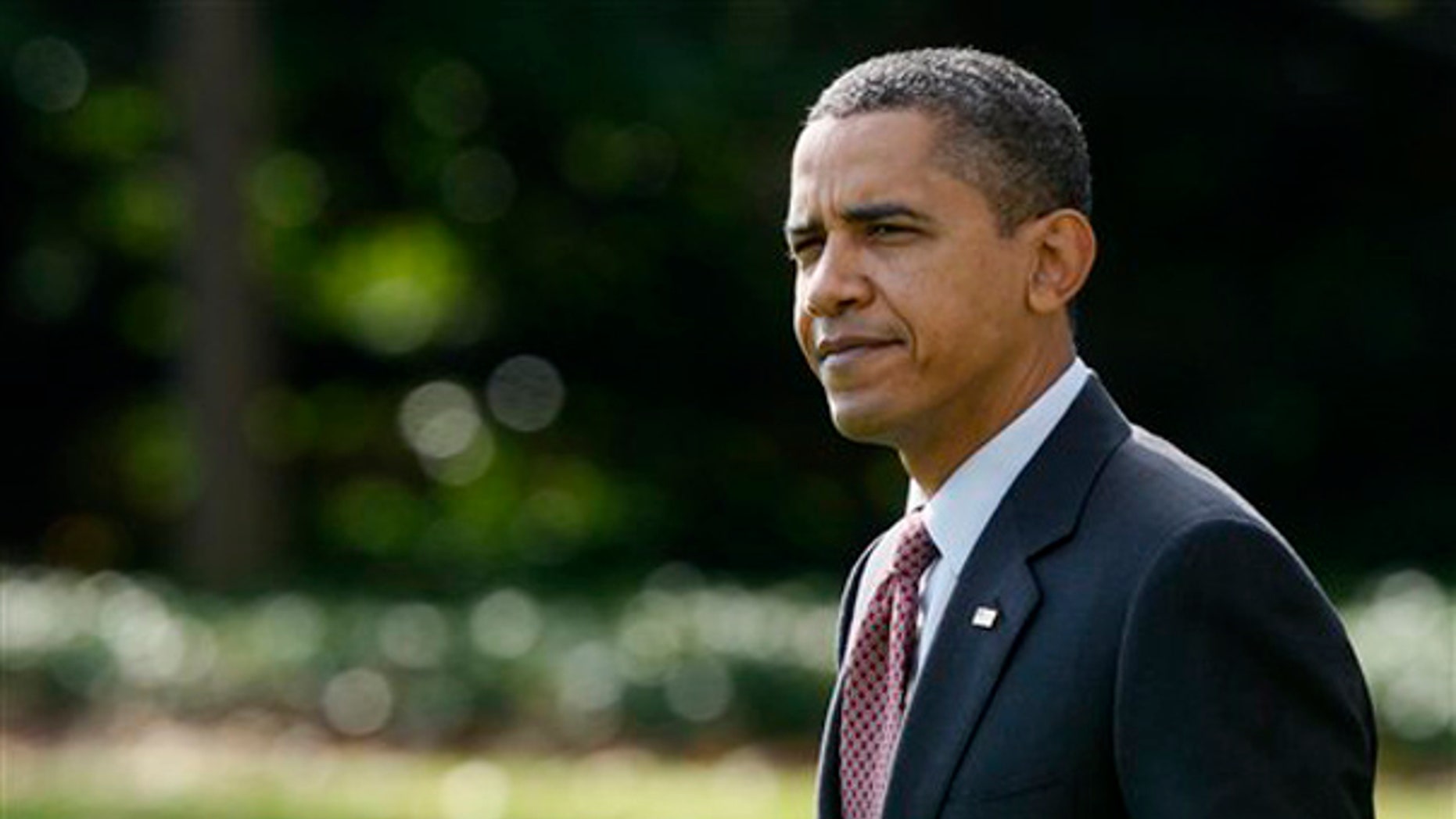 President Obama walks on the South Lawn of the White House, Nov. 4, 2009, as he left for a trip to Madison, Wis. (AP)