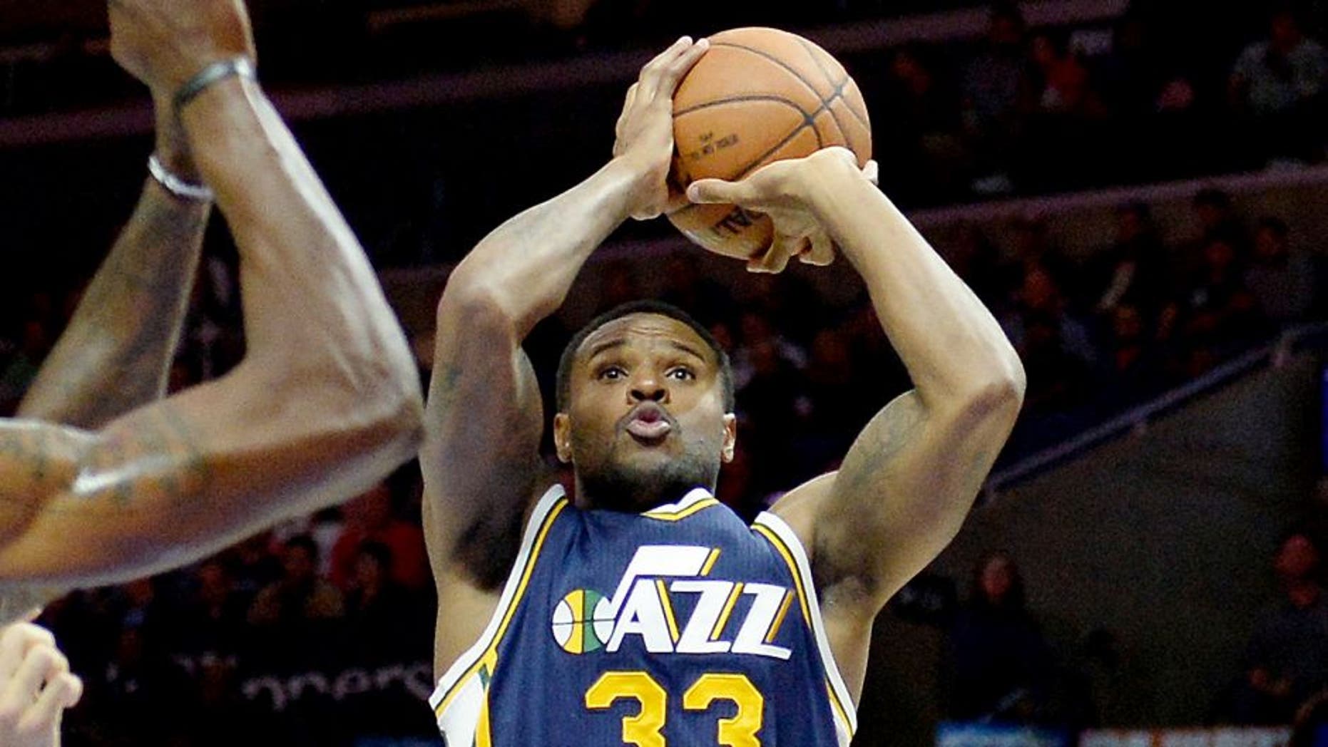 Nov 3, 2014; Los Angeles, CA, USA; Utah Jazz forward Trevor Booker (33) shoots the ball during the first half of a game against the Los Angeles Clippers at Staples Center. Mandatory Credit: Richard Mackson-USA TODAY Sports
