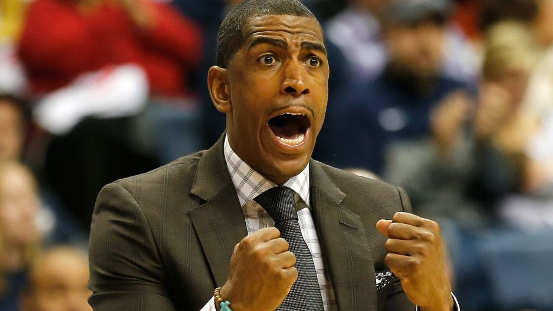 STORRS, CT- NOVEMBER 30: Head coach Kevin Ollie of the Connecticut Huskies reacts during a game with Texas Longhorns at Harry A. Gampel Pavilion on November 30, 2014 in Storrs, Connecticut. (Photo by Jim Rogash/Getty Images)