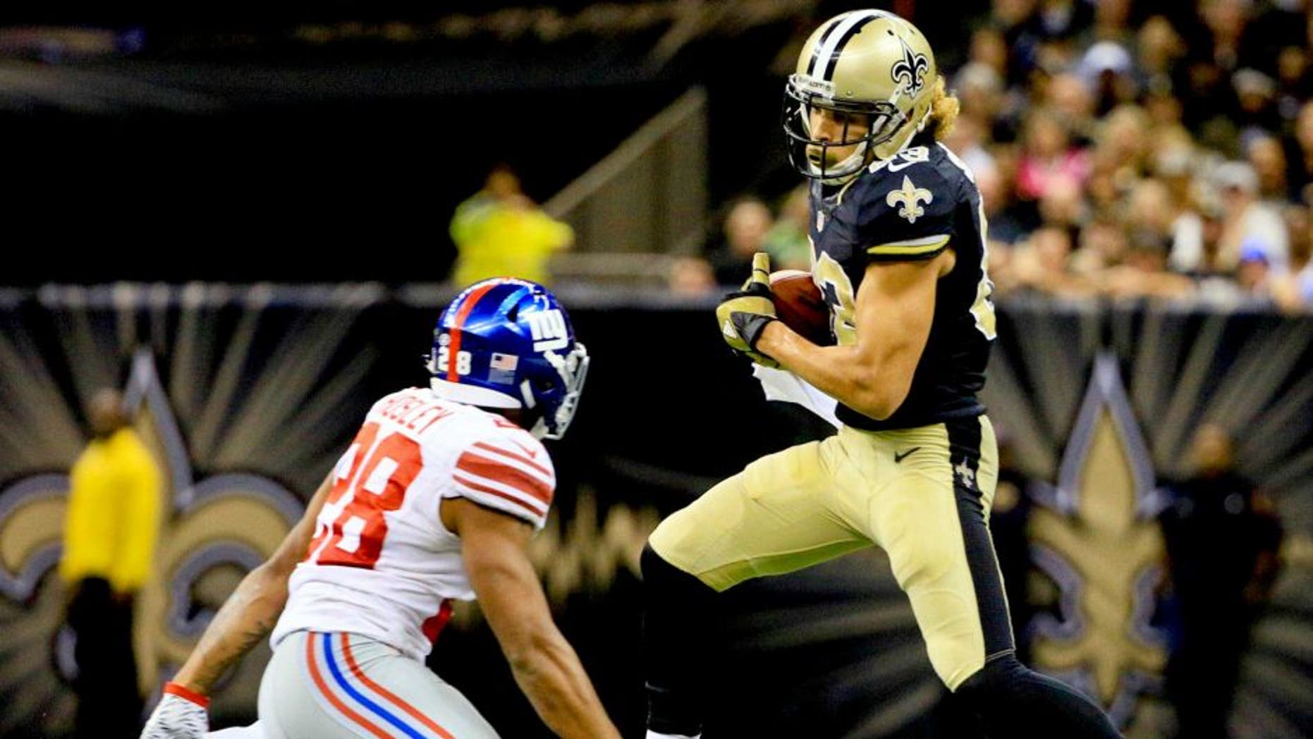 Nov 1, 2015; New Orleans, LA, USA; New Orleans Saints wide receiver Willie Snead (83) catches a pass in front of New York Giants cornerback Jayron Hosley (28) during the fourth quarter of a game at the Mercedes-Benz Superdome. The Saints defeated the Giants 52-49. Mandatory Credit: Derick E. Hingle-USA TODAY Sports