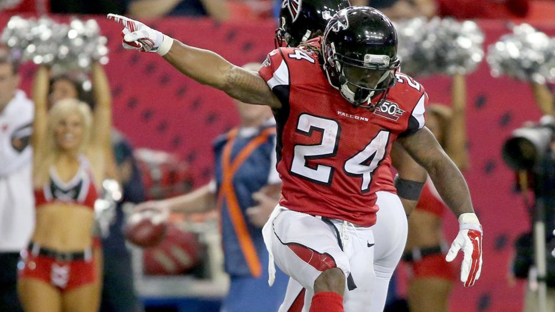 Nov 1, 2015; Atlanta, GA, USA; Atlanta Falcons running back Devonta Freeman (24) celebrates his first down run as Tampa Bay Buccaneers strong safety Chris Conte (23) is shown on the play in the fourth quarter of their game at the Georgia Dome. The Buccaneers won 23-20 in overtime. Mandatory Credit: Jason Getz-USA TODAY Sports