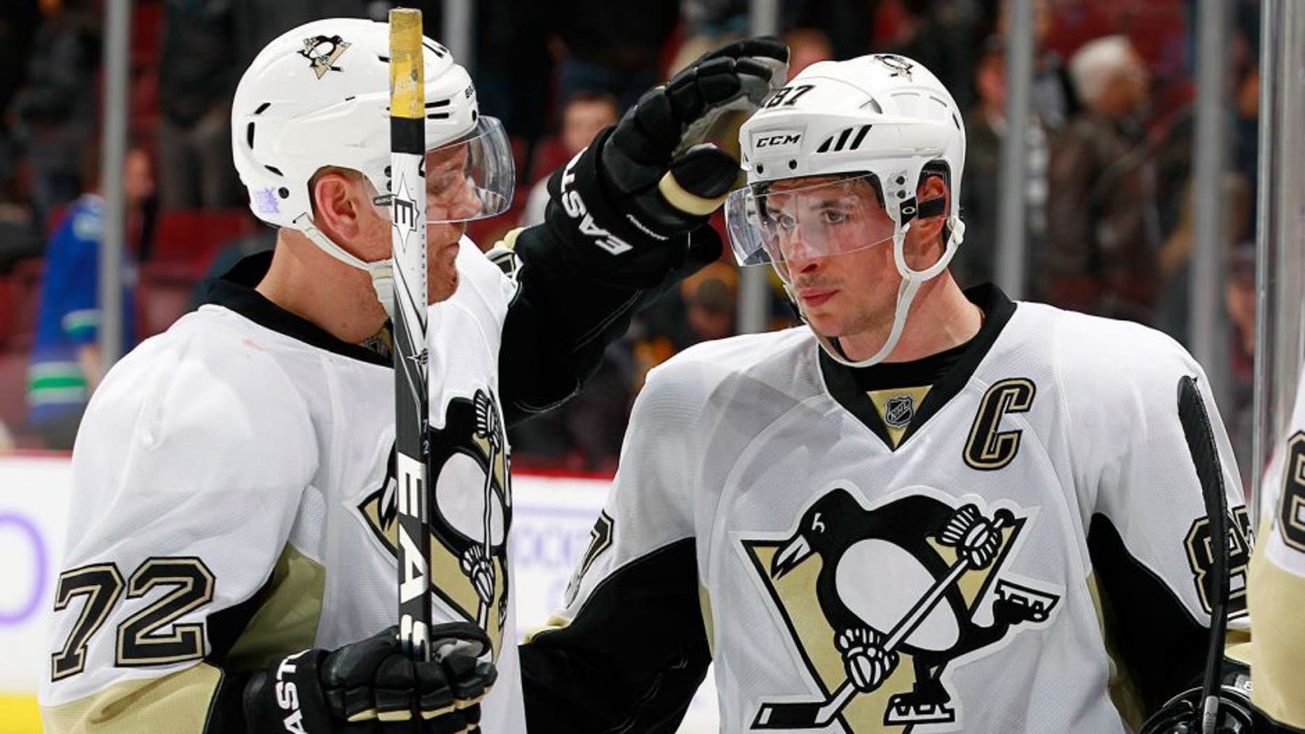 VANCOUVER, BC - NOVEMBER 4: Patric Hornqvist #72 and Sidney Crosby #87 of the Pittsburgh Penguins celebrate a victory over the Vancouver Canucks in their NHL game at Rogers Arena November 4, 2015 in Vancouver, British Columbia, Canada. Pittsburgh won 3-2. (Photo by Jeff Vinnick/NHLI via Getty Images)