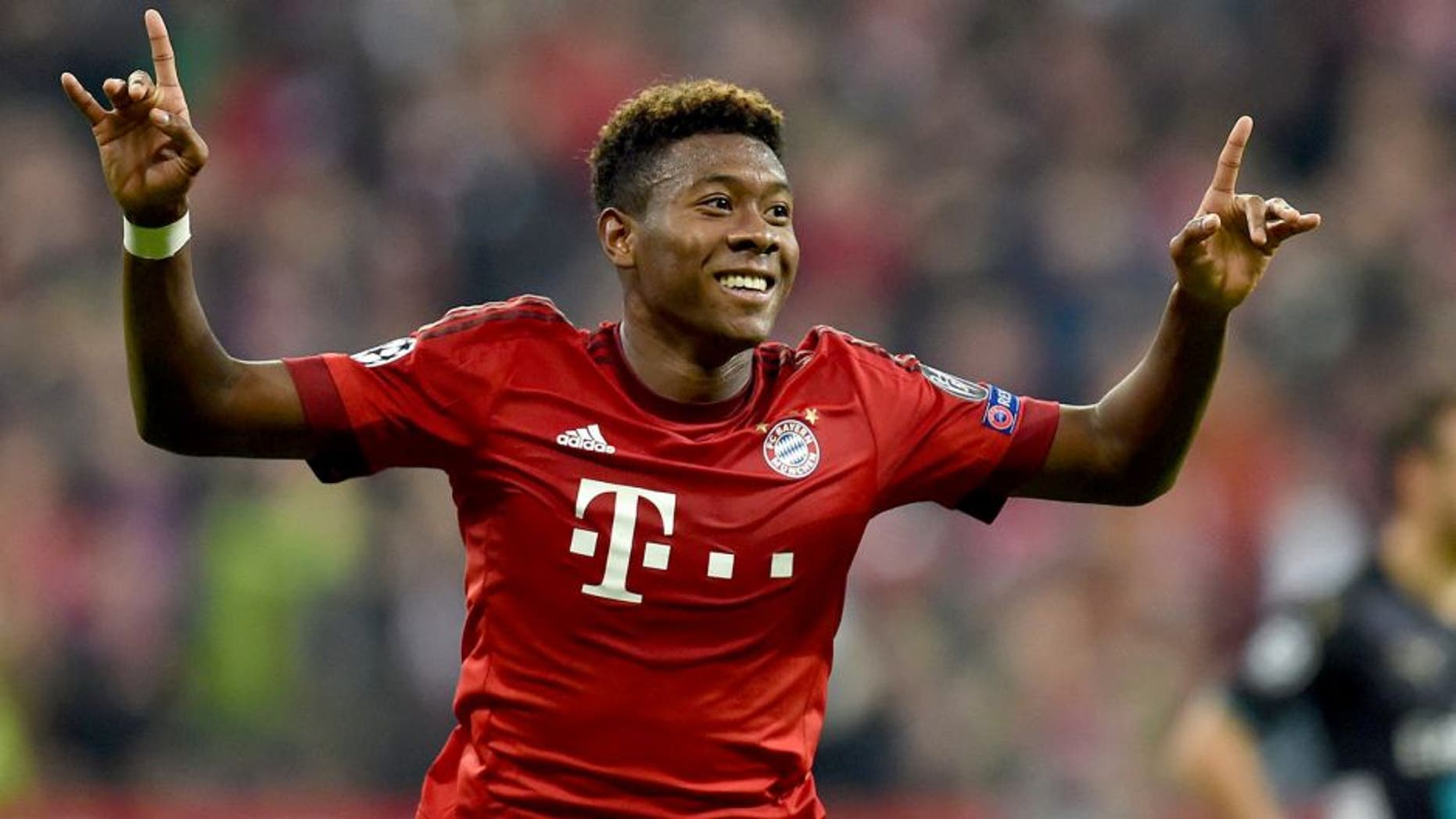 Bayern Munich's Austrian defender David Alaba celebrates after scoring the third goal during the UEFA Champions League Group F second-leg football match between FC Bayern Munich and Arsenal FC in Munich, southern Germany, on November 4, 2015. AFP PHOTO / CHRISTOF STACHE (Photo credit should read CHRISTOF STACHE/AFP/Getty Images)