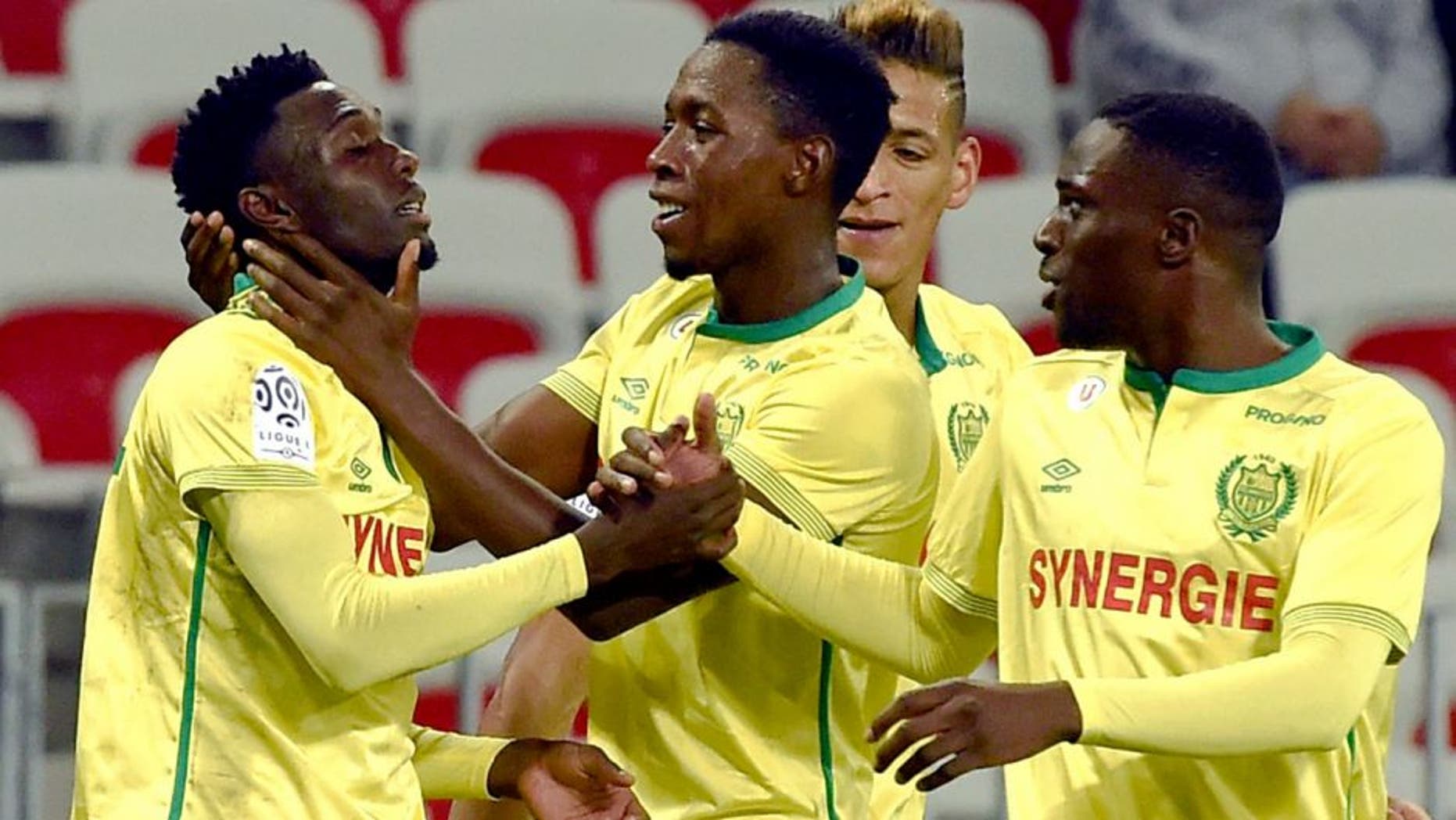 Nantes' forward Alexis Alegue Elandi (L) celebrates with teammates after scoring a goal during the French Ligue 1 football match between Nice and Nantes, on November 4, 2015 at the Allianz Riviera Stadium in Nice, southern France.. AFP PHOTO / ANNE-CHRISTINE POUJOULAT (Photo credit should read ANNE-CHRISTINE POUJOULAT/AFP/Getty Images)