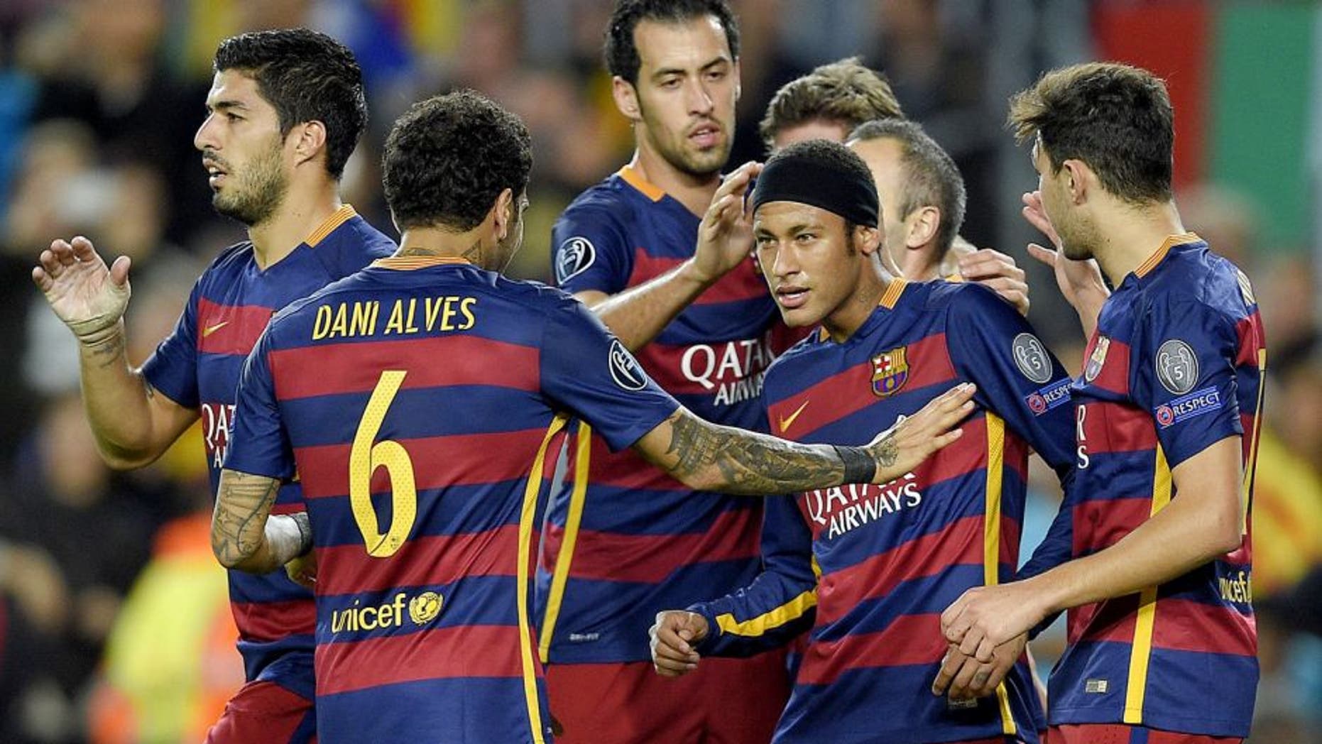 Barcelona's Brazilian forward Neymar (2ndR) celebrates with his teammates after scoring a goal during the UEFA Champions League group E football match FC Barcelona vs FC BATE Borisov at the Camp Nou stadium in Barcelona on November 4, 2015. AFP PHOTO/ LLUIS GENE (Photo credit should read LLUIS GENE/AFP/Getty Images)