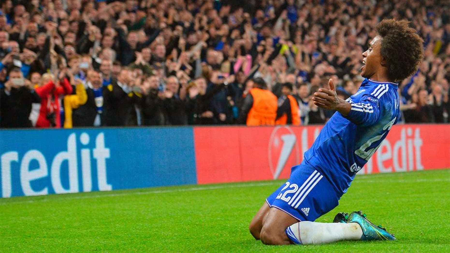 Chelsea's Brazilian midfielder Willian celebrates after scoring from a free kick during a UEFA Chamions league group stage football match between Chelsea and Dynamo Kiev at Stamford Bridge stadium in west London on November 4, 2015. AFP PHOTO / GLYN KIRK (Photo credit should read GLYN KIRK/AFP/Getty Images)