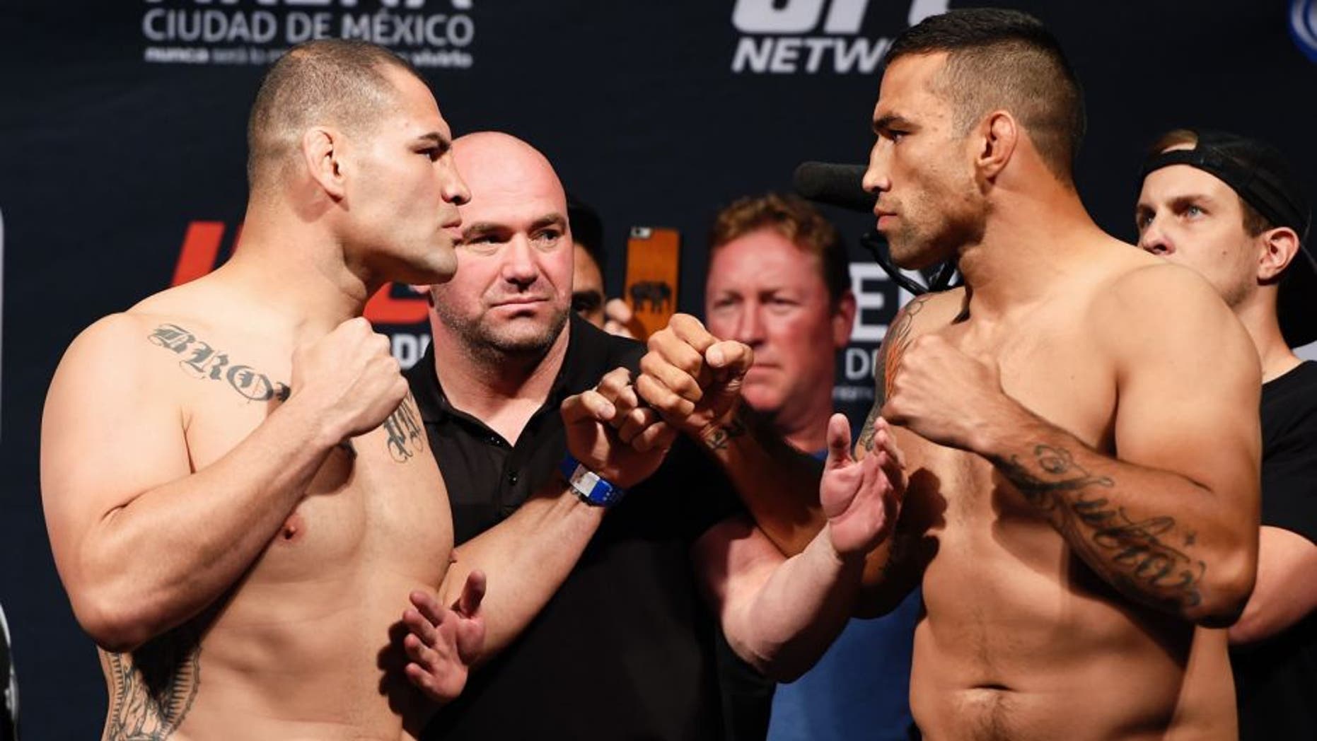 MEXICO CITY, MEXICO - JUNE 12: (L-R) Cain Velasquez of the United States and Fabricio Werdum of Brazil face off during the UFC 188 weigh-in inside the Arena Ciudad de Mexico on June 12, 2015 in Mexico City, Mexico. (Photo by Josh Hedges/Zuffa LLC/Zuffa LLC via Getty Images)