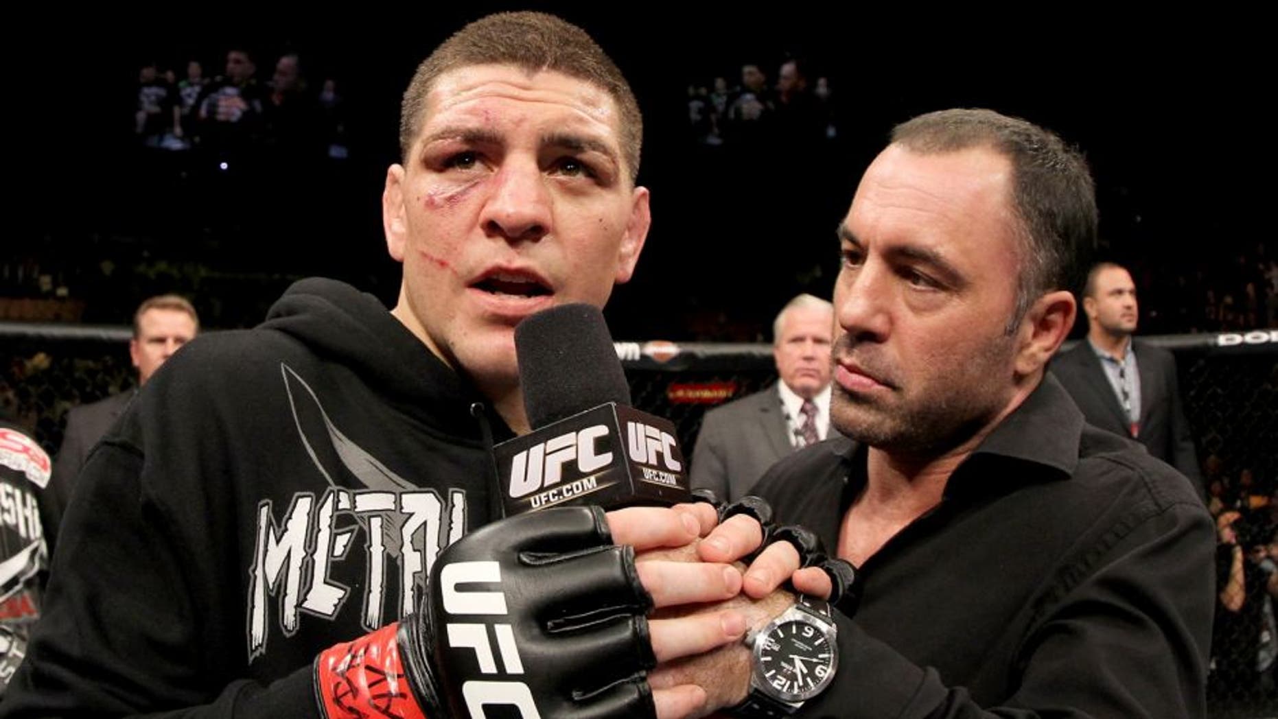 LAS VEGAS, NV - FEBRUARY 04: Nick Diaz (L) is interviewed by Joe Rogan after his victory over Nick Diaz during the UFC 143 event at Mandalay Bay Events Center on February 4, 2012 in Las Vegas, Nevada. (Photo by Josh Hedges/Zuffa LLC/Zuffa LLC via Getty Images)