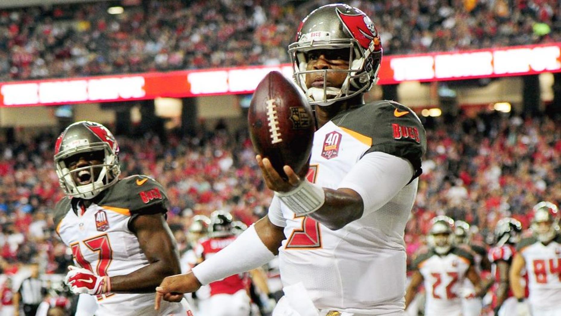 Jameis Winston #3 of the Tampa Bay Buccaneers celebrates a rushing touchdown during the second half against the Atlanta Falcons at the Georgia Dome on November 1, 2015 in Atlanta, Georgia. (Photo by Scott Cunningham/Getty Images)
