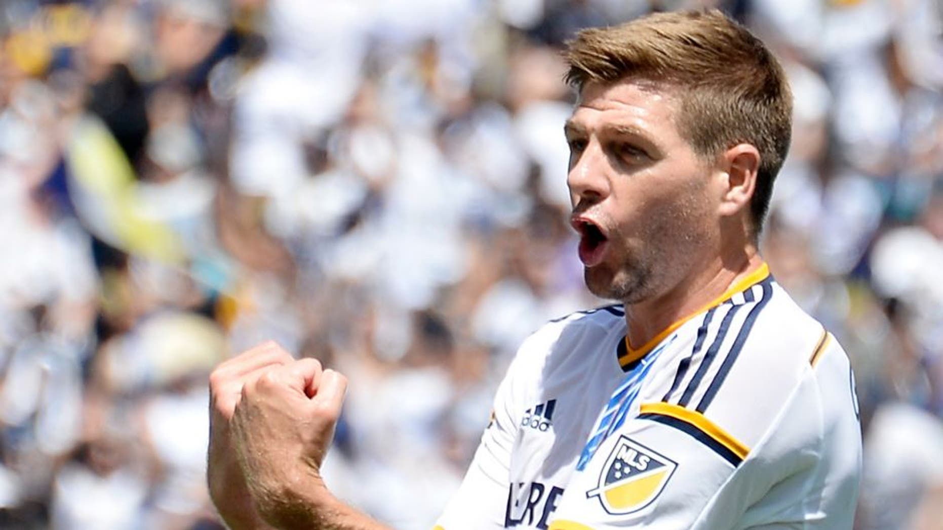 CARSON, CA - AUGUST 23: Steven Gerrard #8 of the Los Angeles Galaxy celebrates teammate Gyasi Zarde's #11 goal against the New York City FC during the first half at StubHub Center August 23, 2015, in Carson, California. (Photo by Kevork Djansezian/Getty Images)