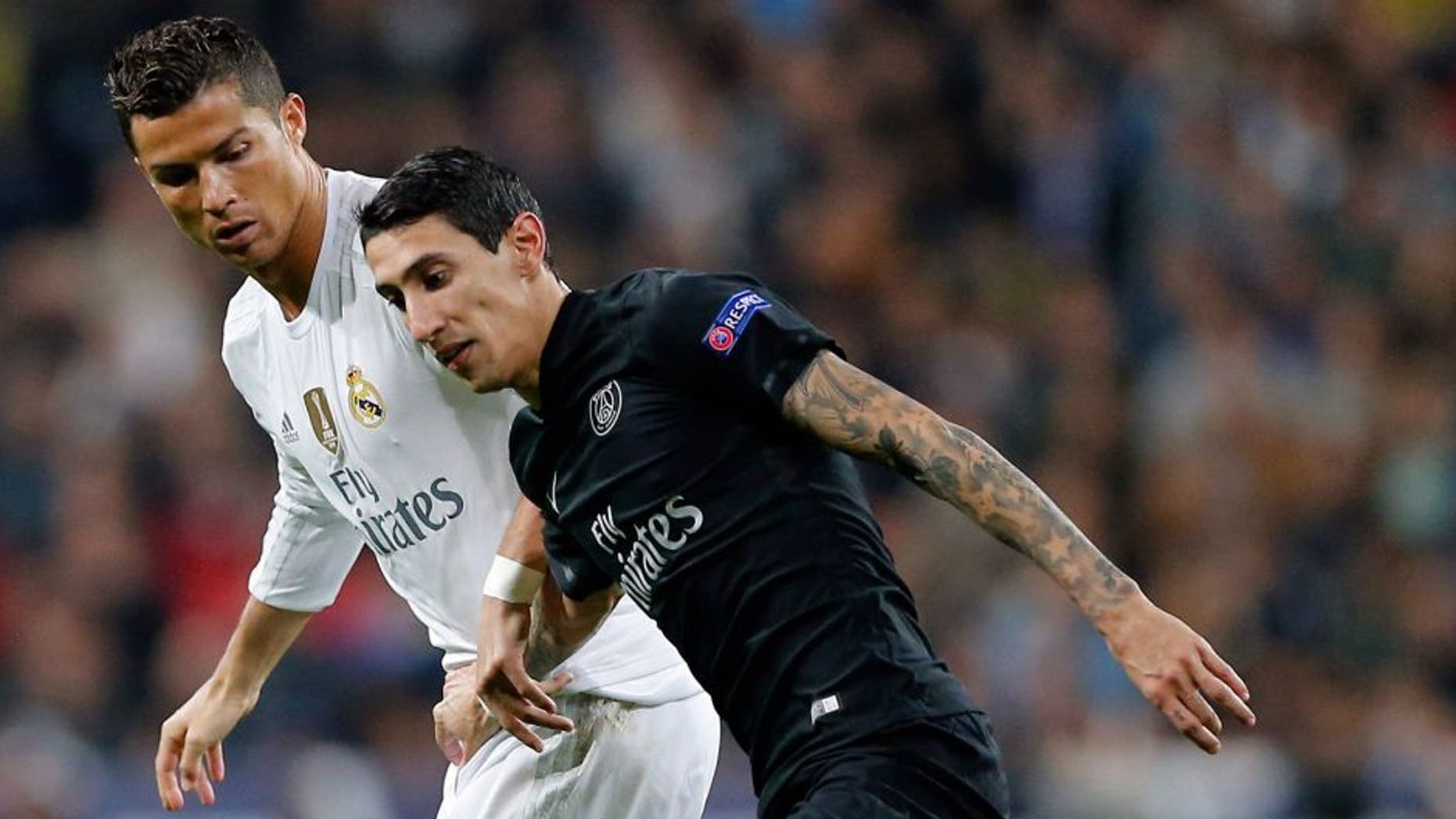 MADRID, SPAIN - NOVEMBER 03: Cristiano Ronaldo (L) of Real Madrid and Angel Di Maria of PSG compete for the ball during the UEFA Champions League Group A match between Real Madrid and Paris Saint-Germain at Estadio Santiago Bernabeu on November 3, 2015 in Madrid, Spain. (Photo by Helios de la Rubia/Real Madrid via Getty Images)