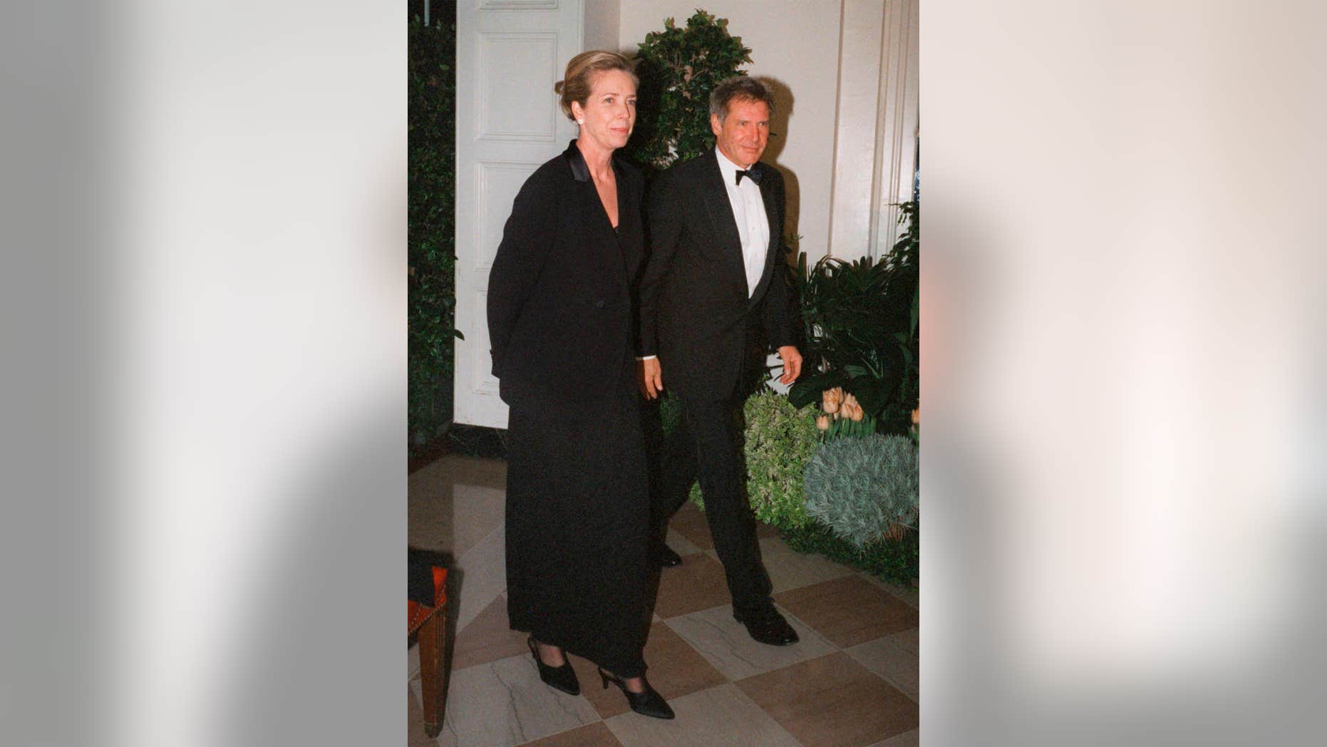 FILE - In this Feb. 5, 1998 file photo, Harrison Ford and his wife Melissa Mathison arrive at the White House for an official dinner for the British Prime Minister hosted by President Clinton in Washington.