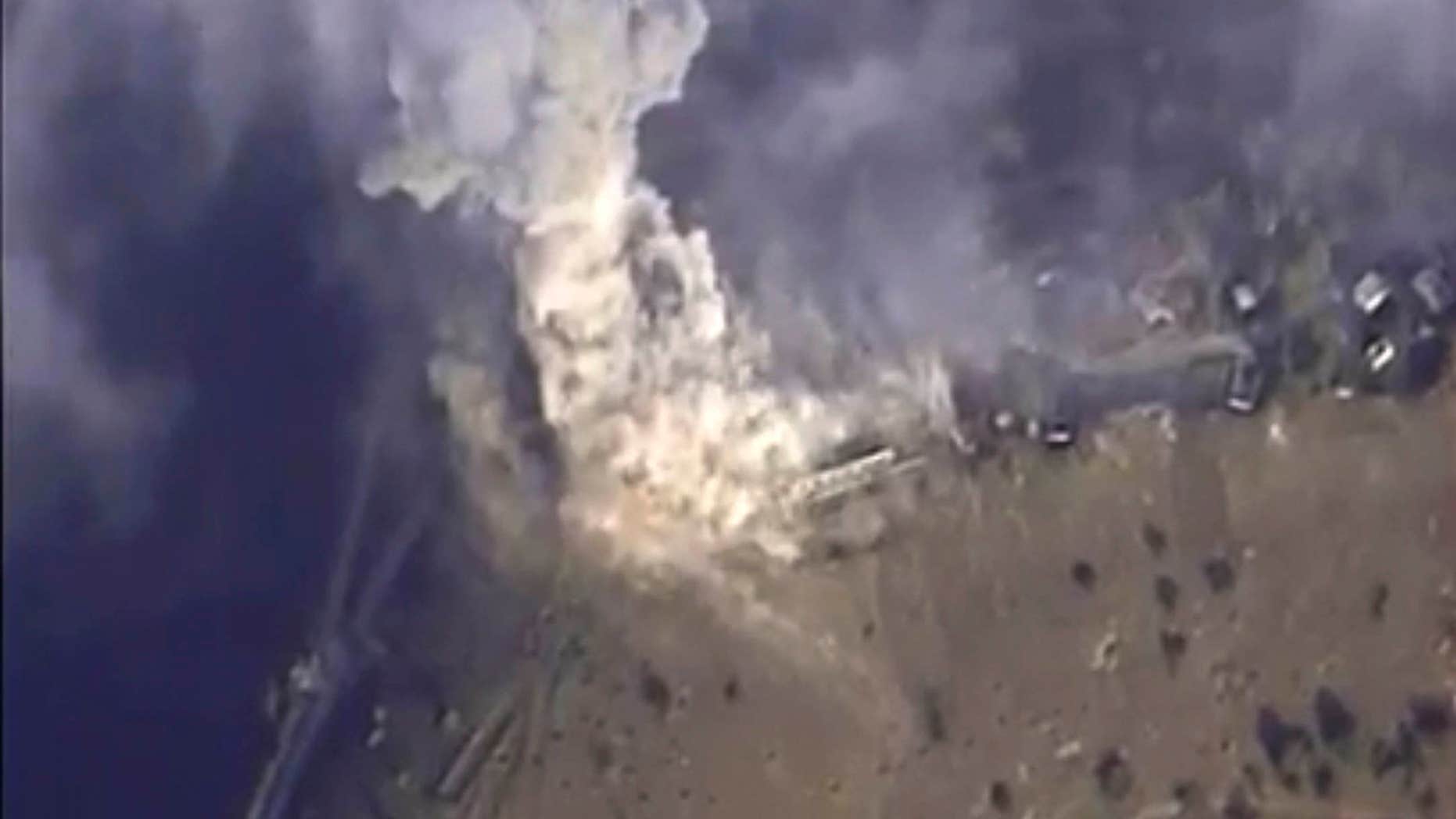 Nov. 2, 2015: This photo made from the footage taken from Russian Defense Ministry official web site shows a target hit during s Russian air raid in Syria.
