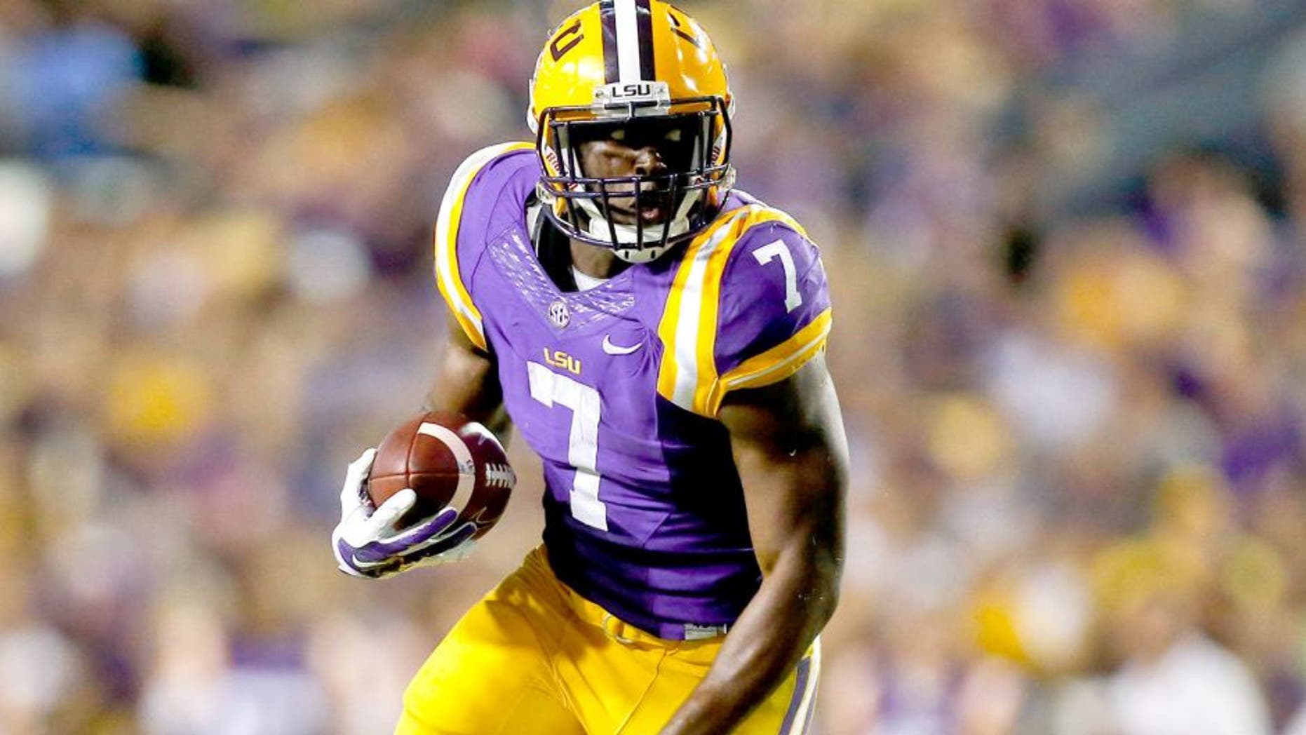 Sep 27, 2014; Baton Rouge, LA, USA; LSU Tigers running back Leonard Fournette (7) breaks loose for a touchdown run against the New Mexico State Aggies during the second quarter of a game at Tiger Stadium. Mandatory Credit: Derick E. Hingle-USA TODAY Sports