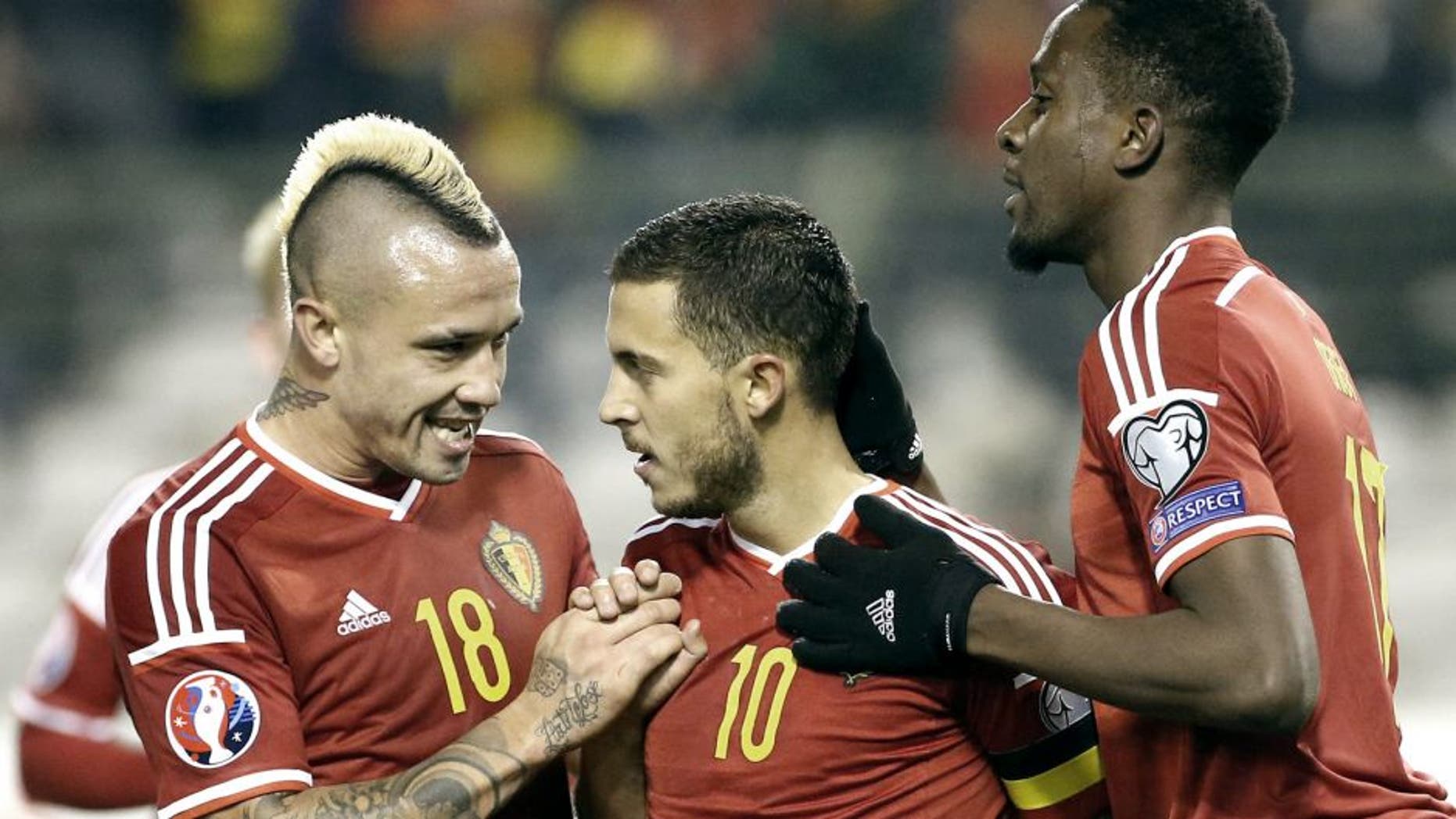 BRUSSELS, BELGIUM - OCTOBER 13: Eden Hazard of Belgium #10 celebrates his goal with Radja Nainggolan and Divock Origi of Belgium during the UEFA EURO 2016 qualifier match between Belgium and Israel at King Baudouin Stadium (Stade du Roi Baudouin) on October 13, 2015 in Brussels, Belgium. (Photo by Jean Catuffe/Getty Images)