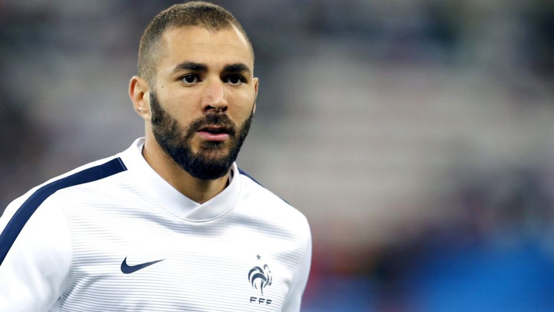 France's forward Karim Benzema looks on during a warm up prior to the friendly football match between France and Armenia on October 8, 2015 at the Allianz Riviera stadium in Nice, southeastern France. AFP PHOTO / VALERY HACHE (Photo credit should read VALERY HACHE/AFP/Getty Images)