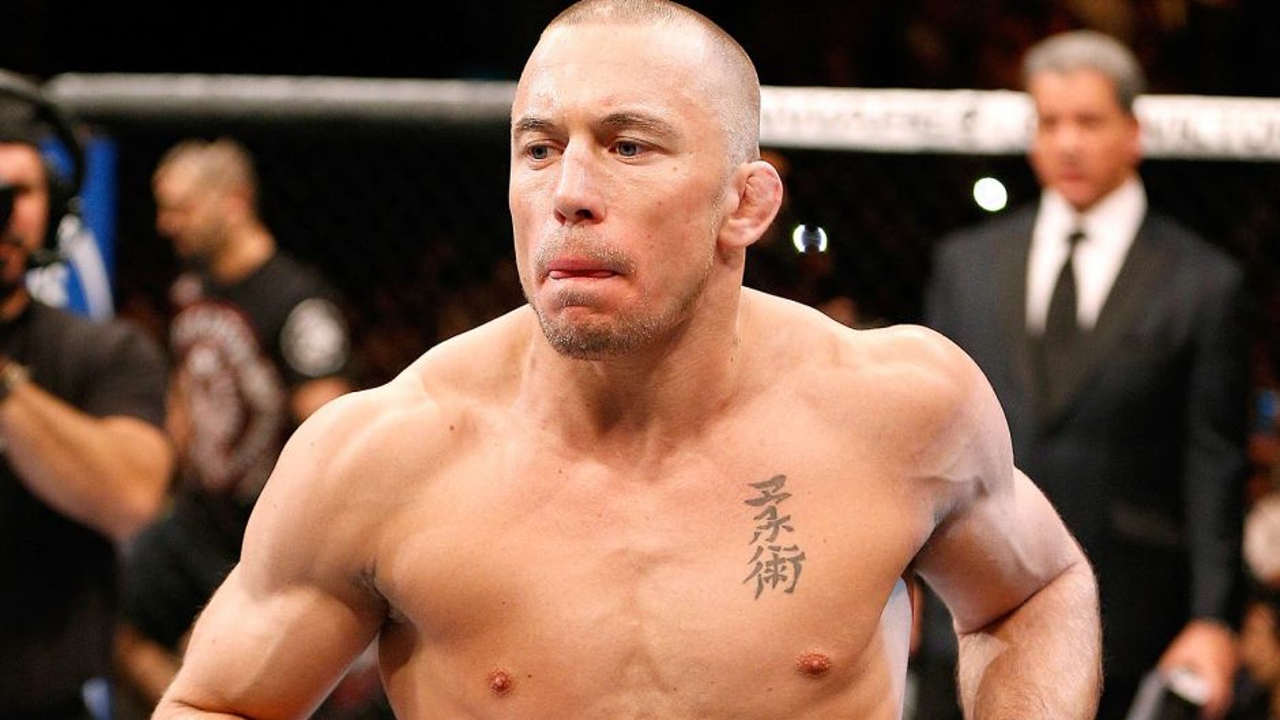LAS VEGAS, NV - NOVEMBER 16: Georges St-Pierre walks into the Octagon to face Johny Hendricks in their UFC welterweight championship bout during the UFC 167 event inside the MGM Grand Garden Arena on November 16, 2013 in Las Vegas, Nevada. (Photo by Josh Hedges/Zuffa LLC/Zuffa LLC via Getty Images)