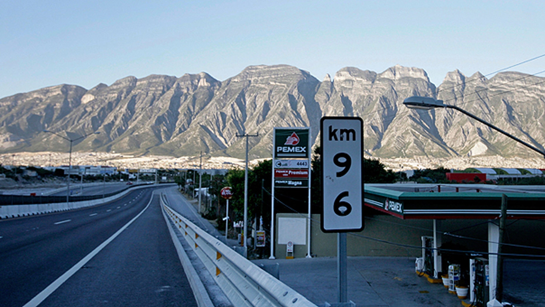 Nov. 5: A gas station is shown on the side of the highway from Saltillo to Monterrey, Mexico. With killings and disappearances to assert their authority, Mexico's drug cartels are beginning to interfere with everyday government activities in pockets of the country, keeping workers off their turf and interrupting some of the most basic services.