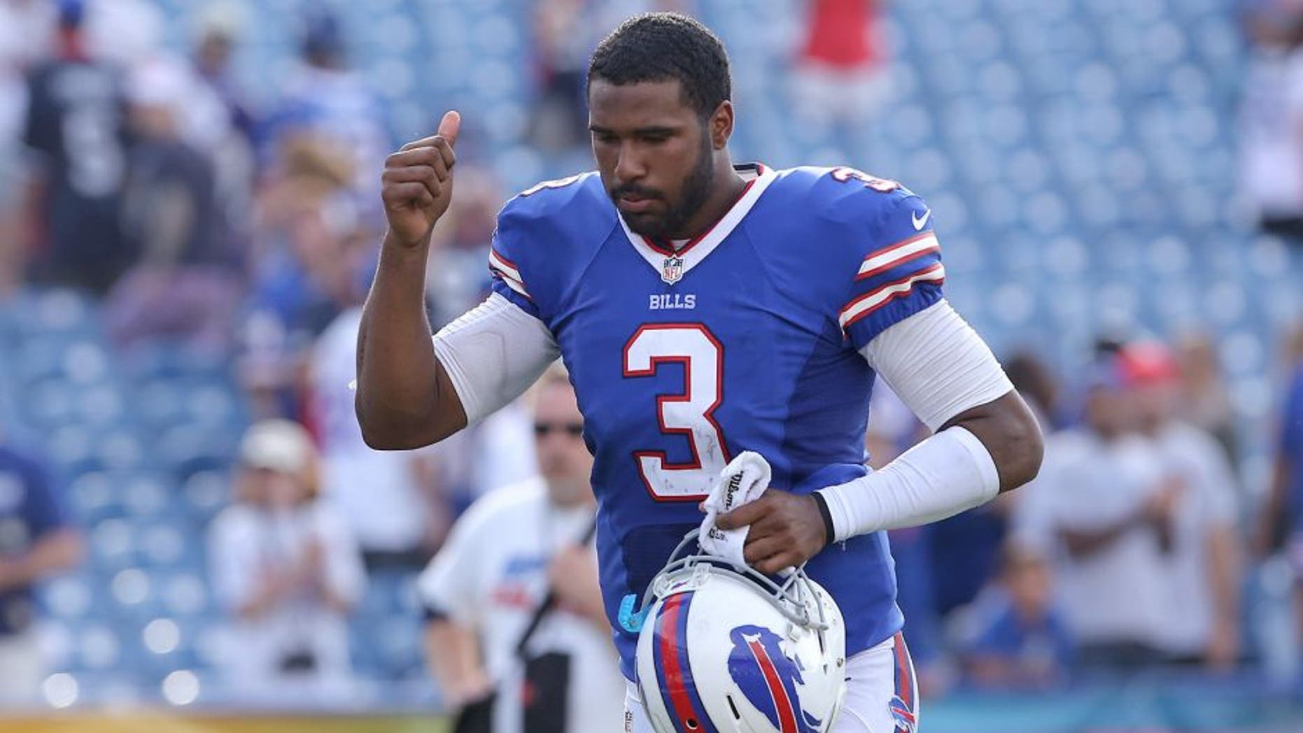 ORCHARD PARK, NY - SEPTEMBER 29: E.J. Manuel #3 of the Buffalo Bills celebrates their victory at the conclusion of their NFL game against the Baltimore Orioles at Ralph Wilson Stadium on September 29, 2013 in Orchard Park, New York. (Photo by Tom Szczerbowski/Getty Images)