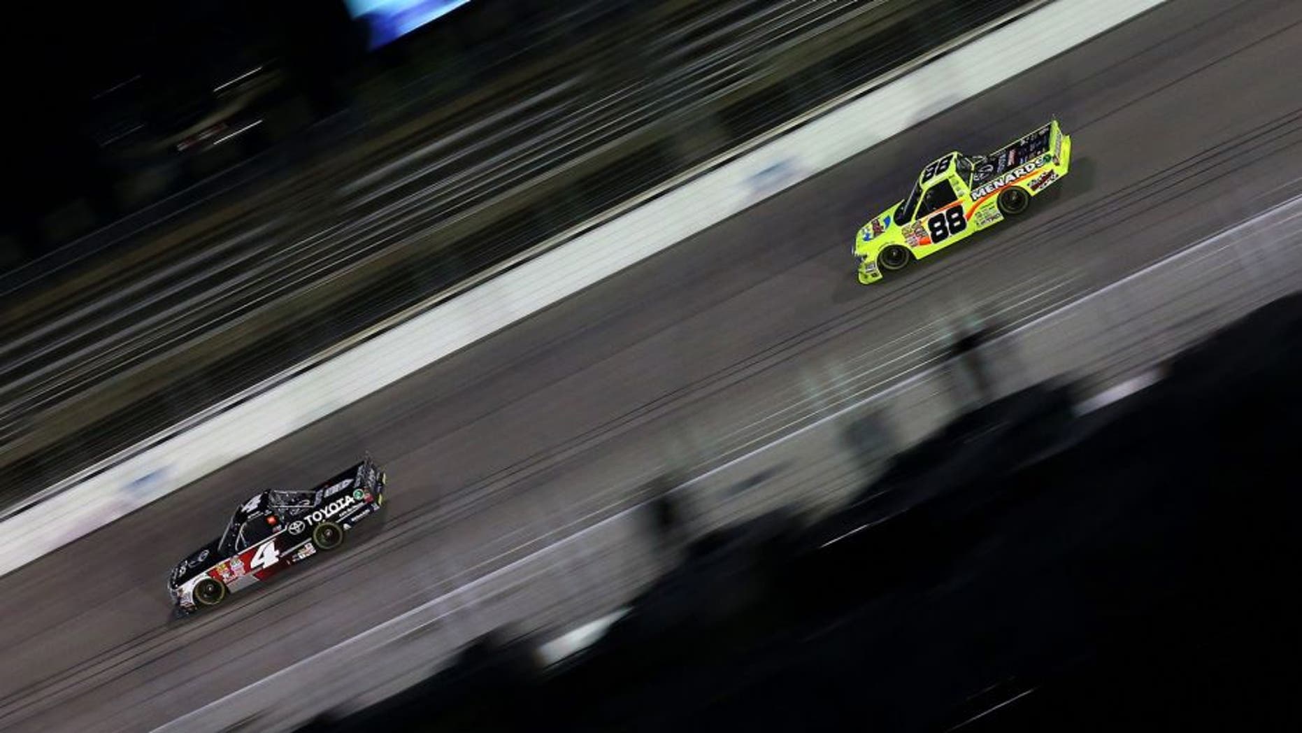 FORT WORTH, TX - NOVEMBER 06: Erik Jones, driver of the #4 Toyota, leads Matt Crafton, driver of the #88 Damp Rid/Menards Toyota, during the NASCAR Camping World Truck Series WinStar World Casino 350 at Texas Motor Speedway on November 6, 2015 in Fort Worth, Texas. (Photo by Sarah Crabill/Getty Images for Texas Motor Speedway)