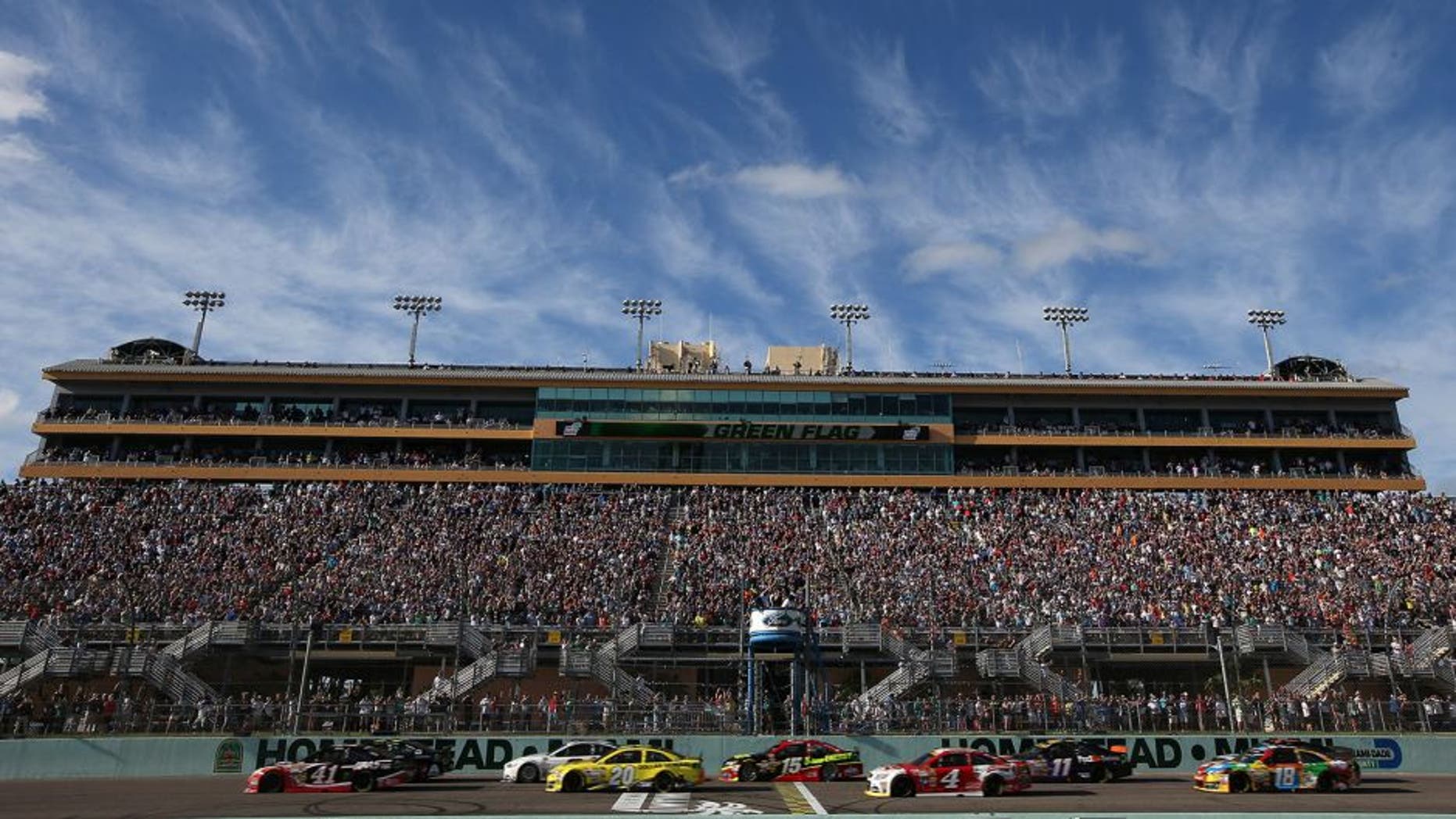 HOMESTEAD, FL - NOVEMBER 16: Jeff Gordon, driver of the #24 Drive To End Hunger Chevrolet, and Kurt Busch, driver of the #41 Haas Automation Chevrolet, lead the field on the first lap of the NASCAR Sprint Cup Series Ford EcoBoost 400 at Homestead-Miami Speedway on November 16, 2014 in Homestead, Florida. (Photo by Chris Graythen/Getty Images)