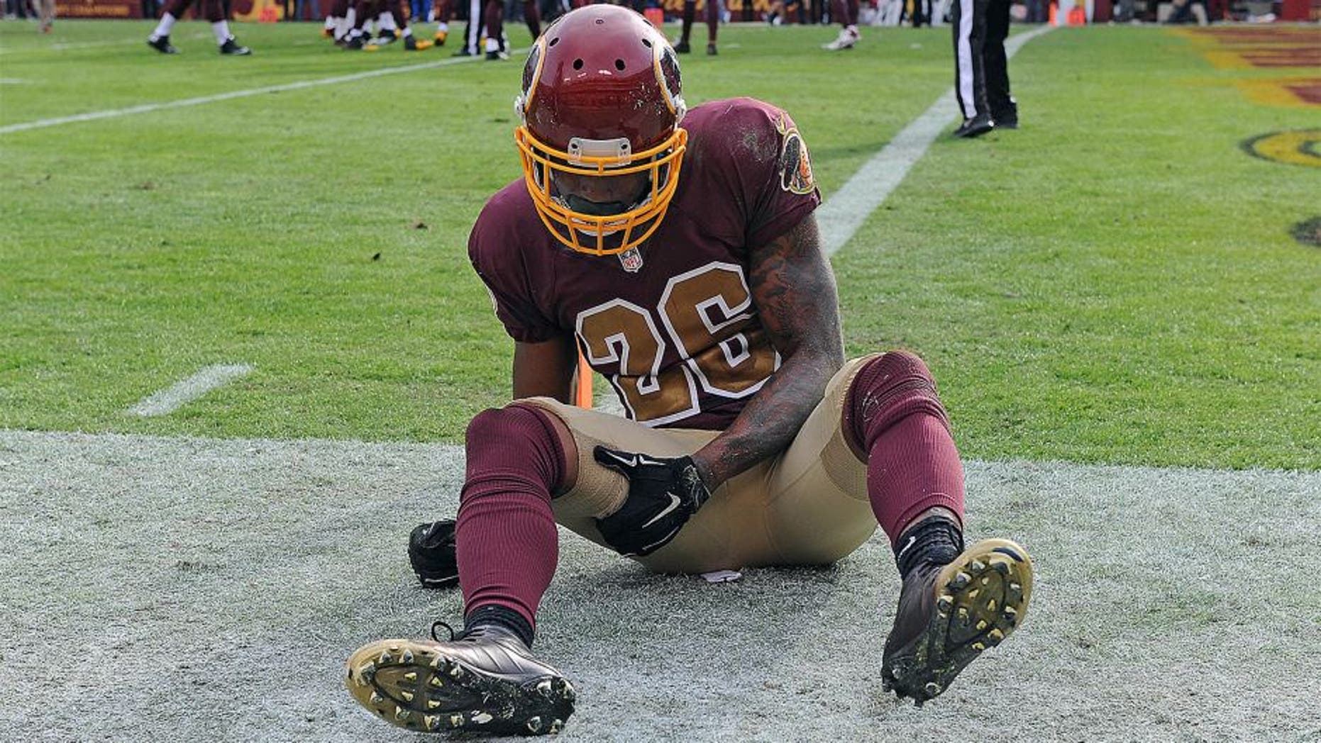 Oct 25, 2015; Landover, MD, USA; Washington Redskins cornerback Bashaud Breeland (26) holds his leg after suffering an apparent injury against the Tampa Bay Buccaneers during the second half at FedEx Field. The Washington Redskins won 31 - 30. Mandatory Credit: Brad Mills-USA TODAY Sports