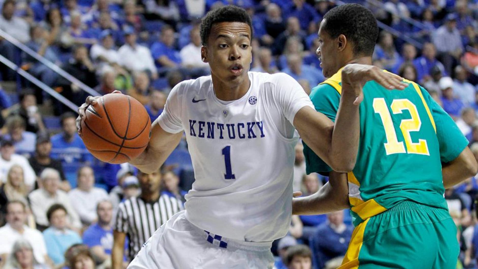 Nov 6, 2015; Lexington, KY, USA; Kentucky Wildcats forward Skal Labissiere (1) dribbles the ball against the Kentucky State Thorobreds center Julius Barton (12) in the second half at Rupp Arena. Kentucky defeated Kentucky State 111-58. Mandatory Credit: Mark Zerof-USA TODAY Sports