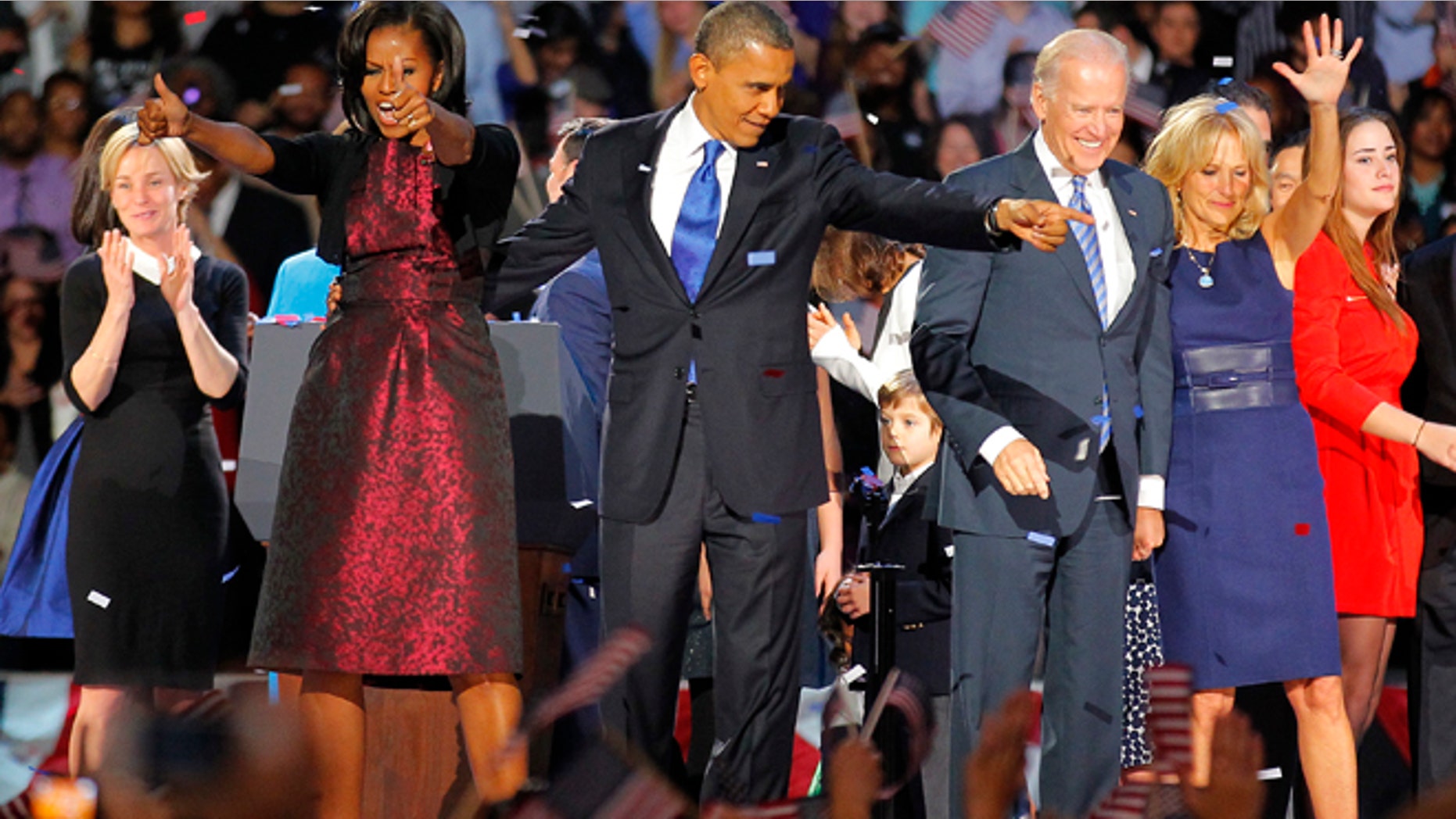 Nov. 7 2012: President Barack Obama , joined by his wife Michelle, Vice President Joe Biden and his spouse Jill acknowledge applause after Obama delivered his victory speech to supporters gathered in Chicago.