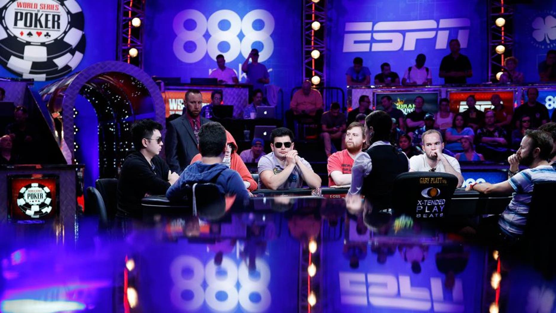 FILE - In this July 14, 2015, file photo, players compete at the World Series of Poker main event in Las Vegas. The World Series of Poker's main event returns Sunday, Nov. 8, offering a $7.6 million prize to the victor. (AP Photo/John Locher, File)