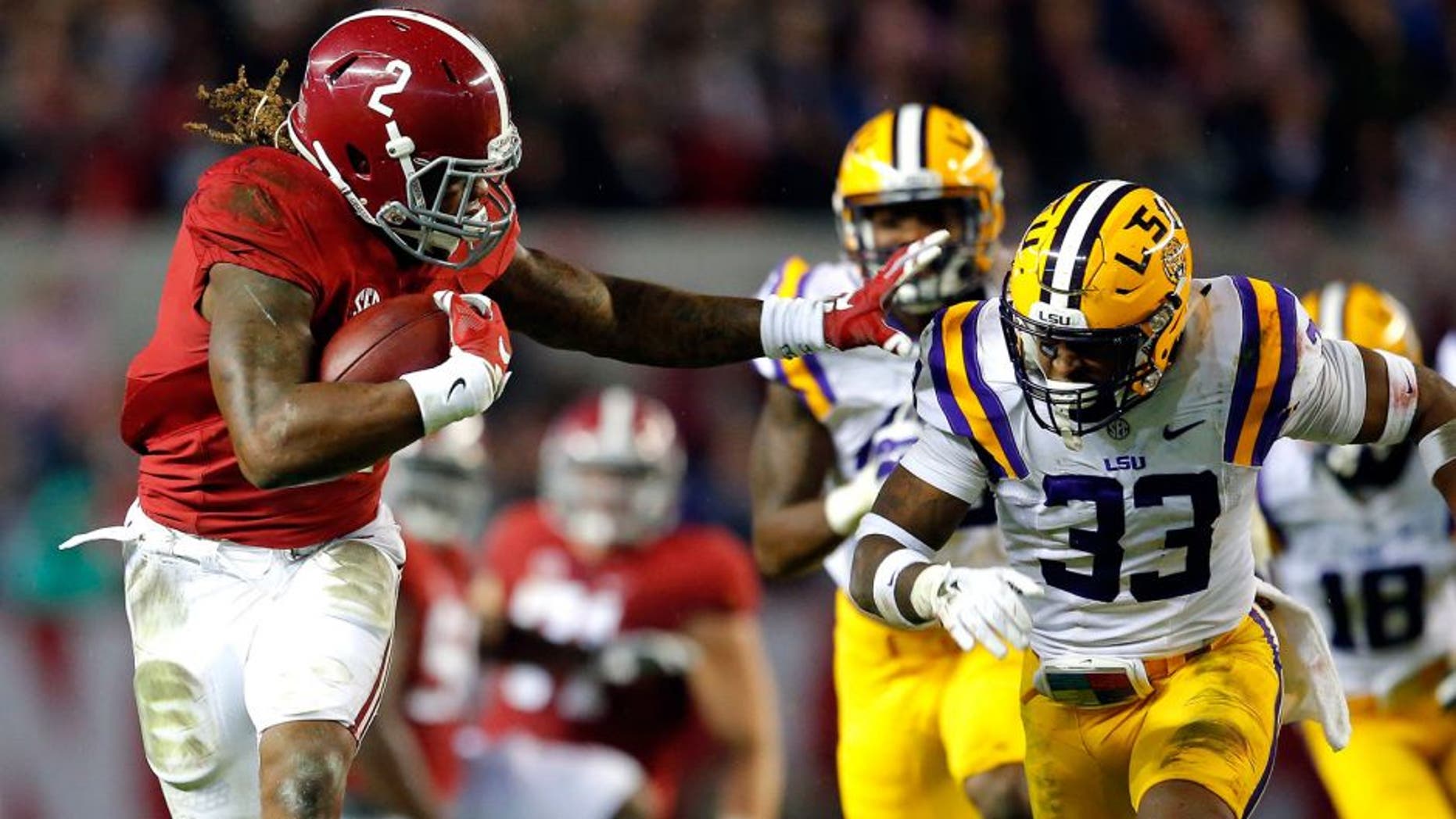 TUSCALOOSA, AL - NOVEMBER 07: Derrick Henry #2 of the Alabama Crimson Tide rushes away from Jamal Adams #33 of the LSU Tigers in the second quarter at Bryant-Denny Stadium on November 7, 2015 in Tuscaloosa, Alabama. (Photo by Kevin C. Cox/Getty Images)