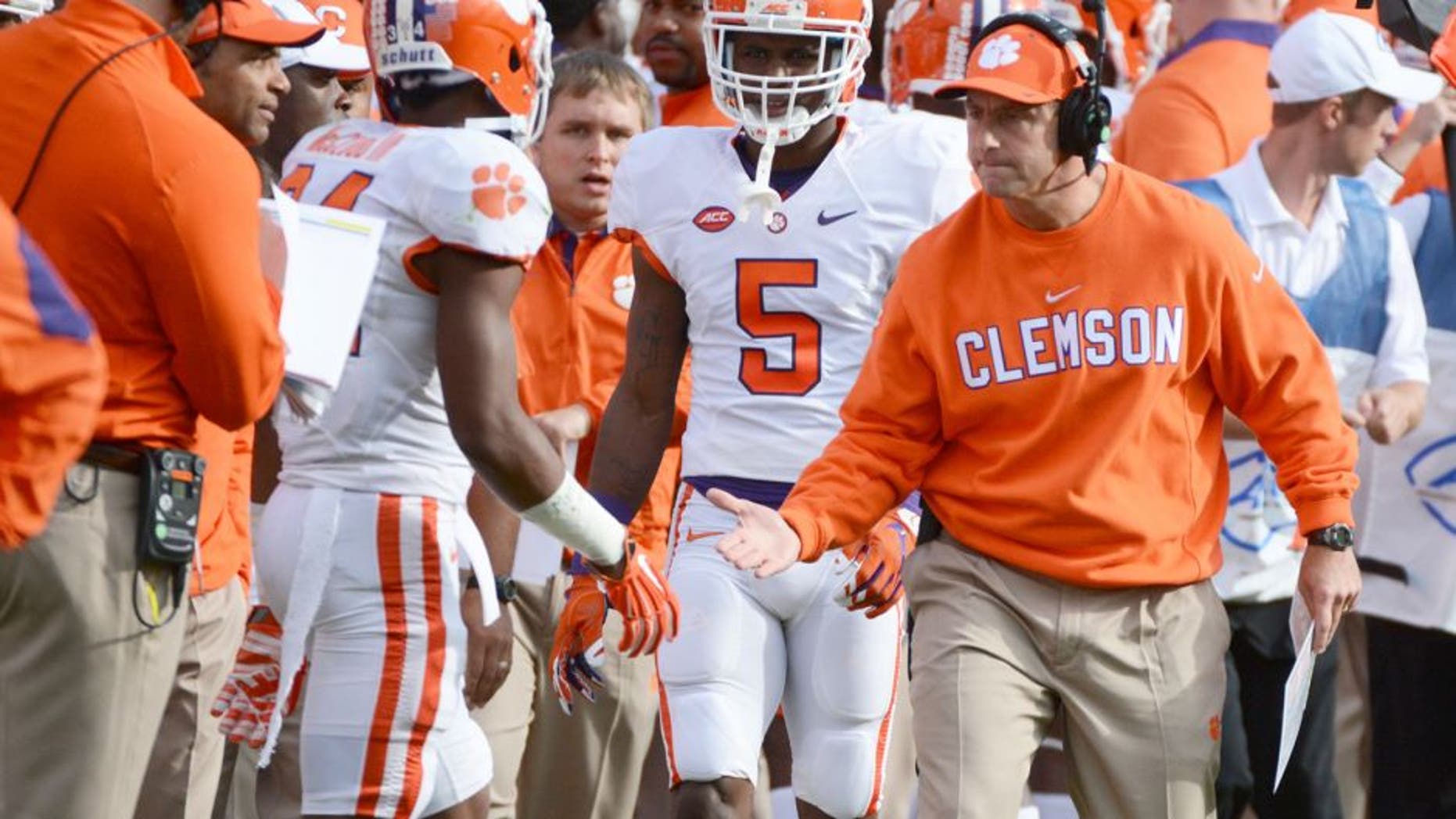 Oct 31, 2015; Raleigh, NC, USA; Clemson Tigers head coach Dabo Swinney congratulates wide receiver Ray-Ray McCloud (34) after a return during the first half against the North Carolina State Wolfpack at Carter Finley Stadium. Mandatory Credit: Rob Kinnan-USA TODAY Sports