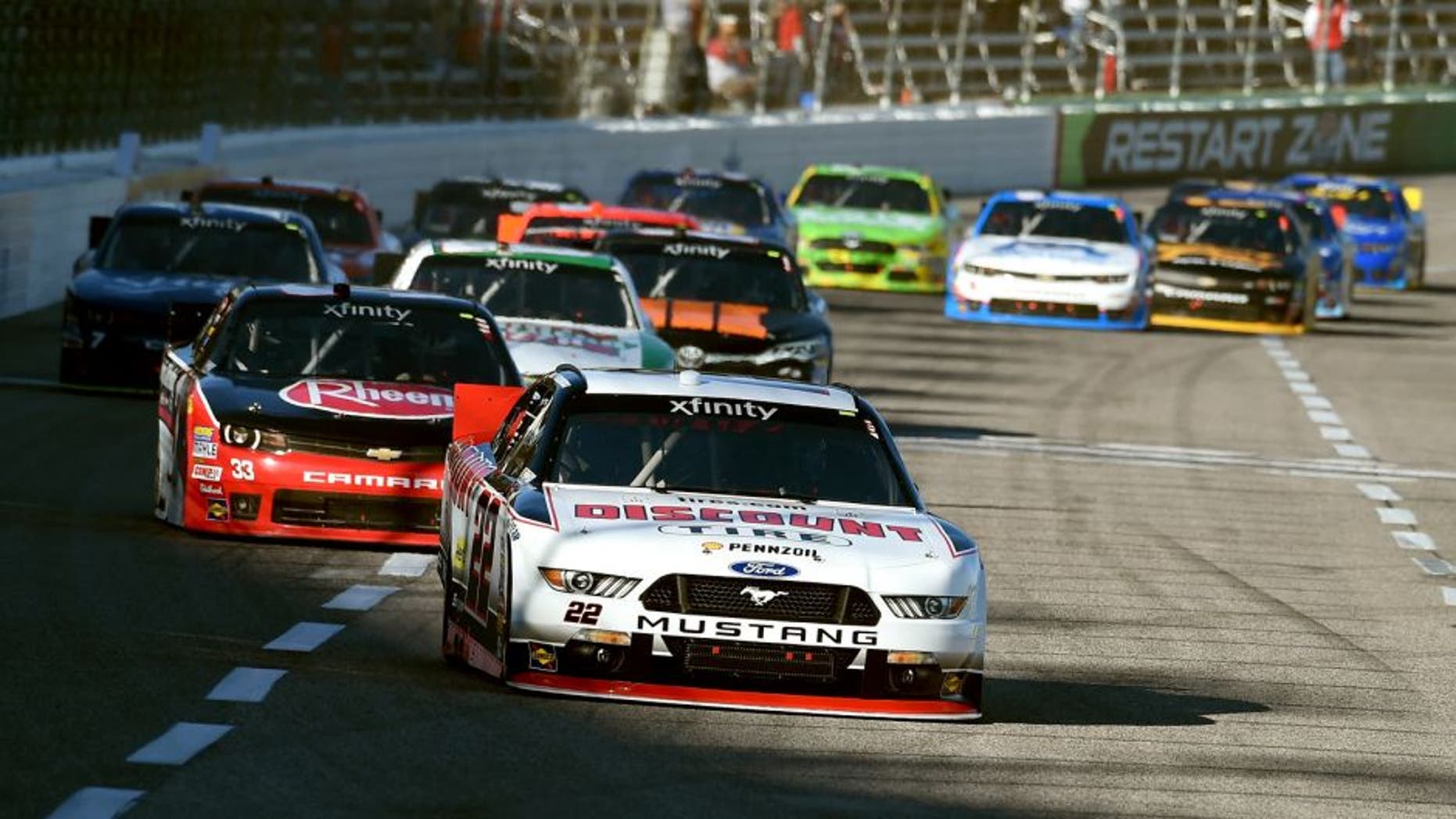 FORT WORTH, TX - NOVEMBER 07: Brad Keselowski, driver of the #22 Discount Tire Ford, leads a pack of cars during the NASCAR XFINITY Series O'Reilly Auto Parts Challenge at Texas Motor Speedway on November 7, 2015 in Fort Worth, Texas. (Photo by Rainier Ehrhardt/NASCAR via Getty Images)