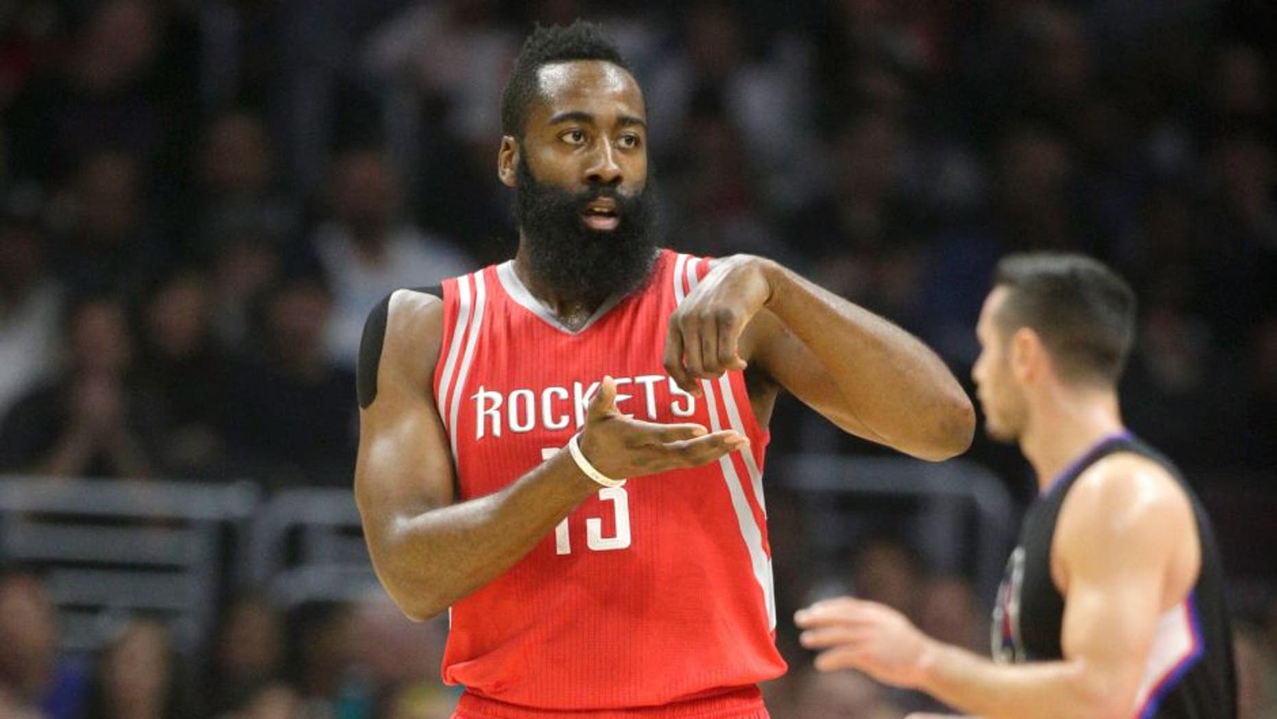 Houston Rockets' James Harden gestures after making a basket during the first half of an NBA basketball game against the Los Angeles Clippers, Saturday, Nov. 7, 2015, in Los Angeles. (AP Photo/Jae C. Hong)