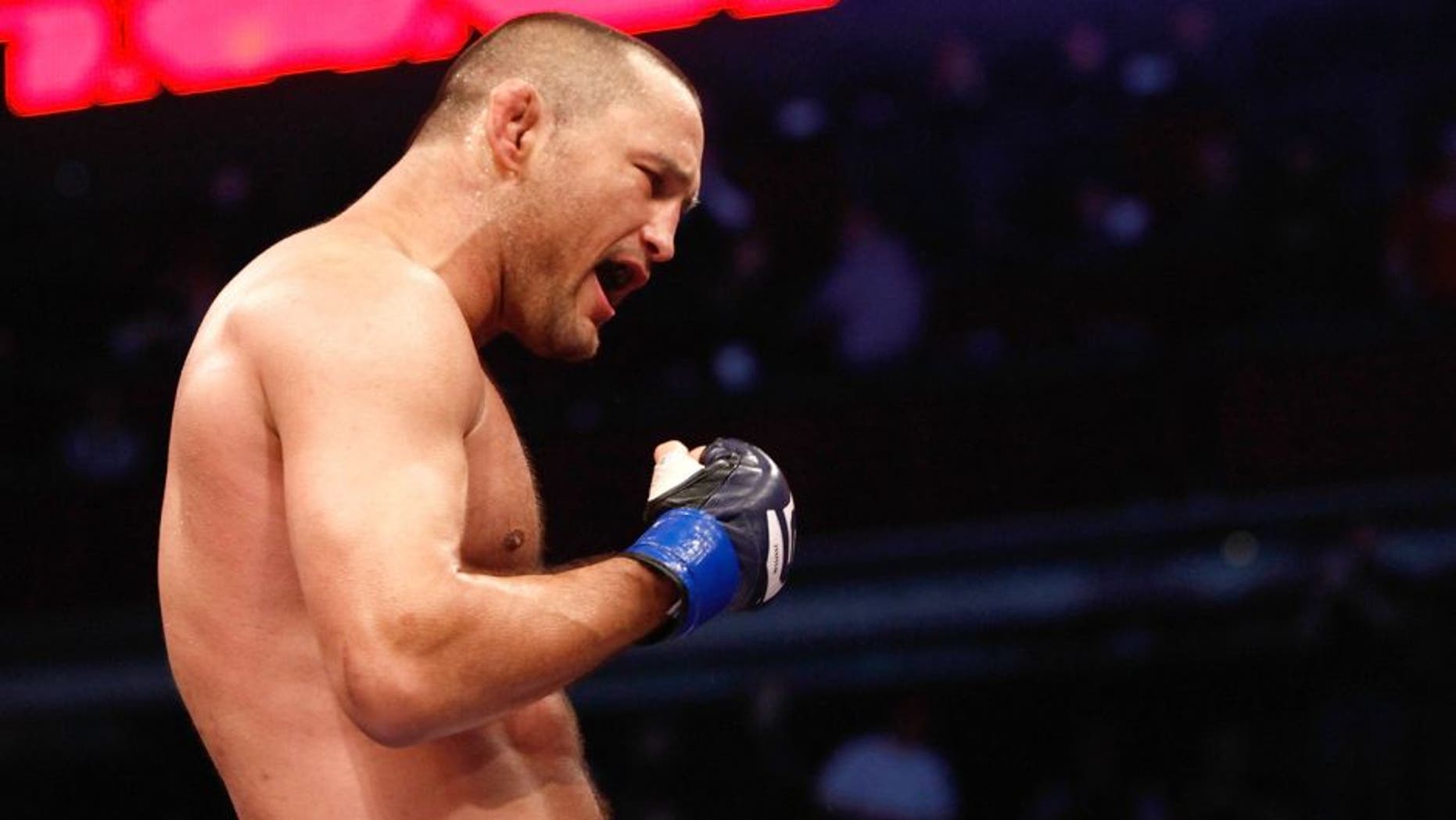 COLUMBUS, OH - MARCH 05: Dan Henderson celebrates his TKO victory over Rafael "Feijao" Cavalcante to capture the Strikeforce Light Heavyweight Championship at the Strikeforce: Feijao vs. Henderson event at Nationwide Arena on March 5, 2011 in Columbus, Ohio. (Photo by Esther Lin/Zuffa LLC/Zuffa LLC via Getty Images)