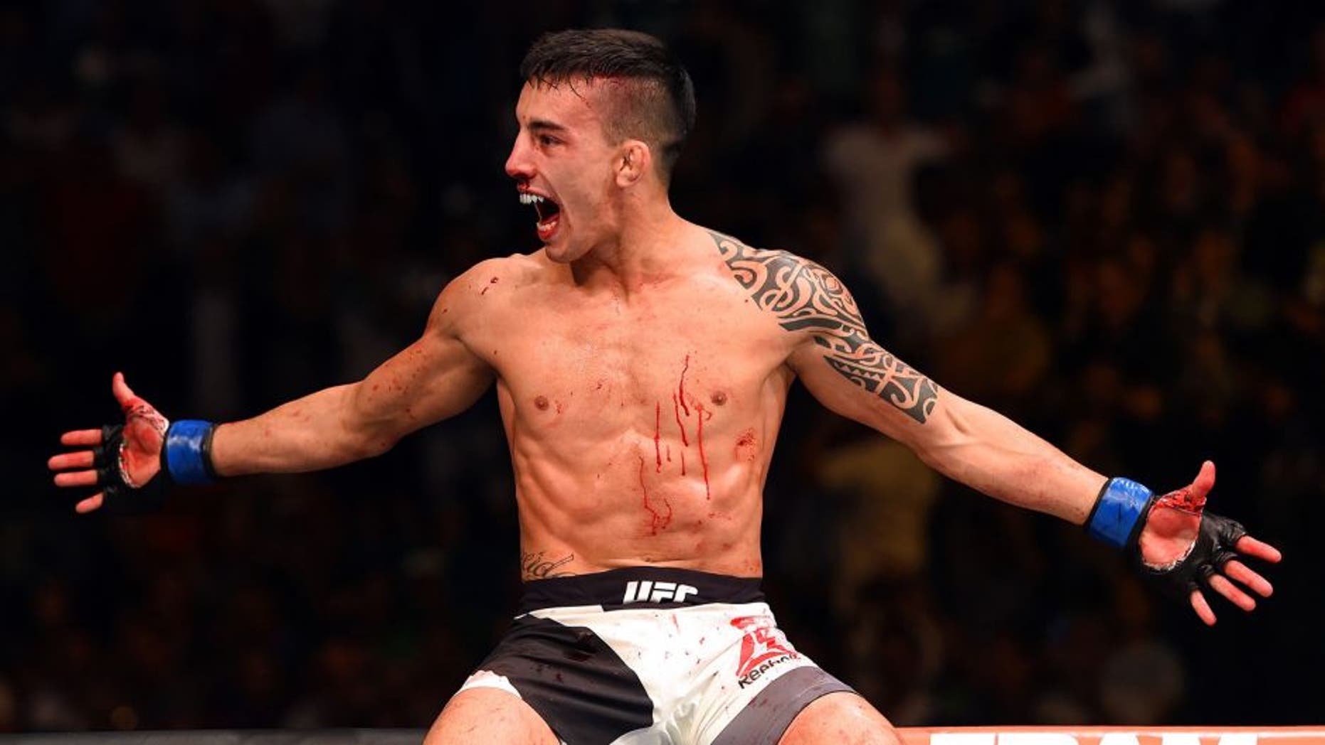 LAS VEGAS, NV - JULY 11: Thomas Almeida celebrates his win over Brad Pickett in their bantamweight fight during the UFC 189 event inside MGM Grand Garden Arena on July 11, 2015 in Las Vegas, Nevada. (Photo by Josh Hedges/Zuffa LLC/Zuffa LLC via Getty Images)