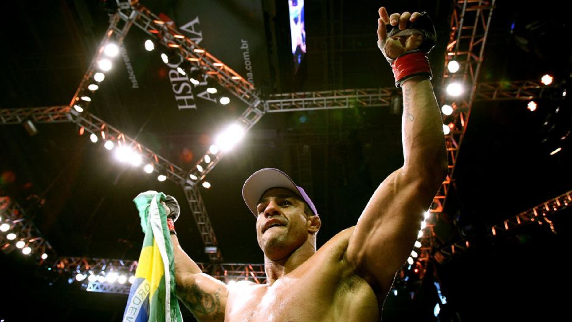 RIO DE JANEIRO, BRAZIL - JANUARY 14: Vitor Belfort celebrates defeating Anthony Johnson (not pictured) in a middleweight bout during UFC 142 at HSBC Arena on January 14, 2012 in Rio de Janeiro, Brazil. (Photo by Josh Hedges/Zuffa LLC/Zuffa LLC via Getty Images)