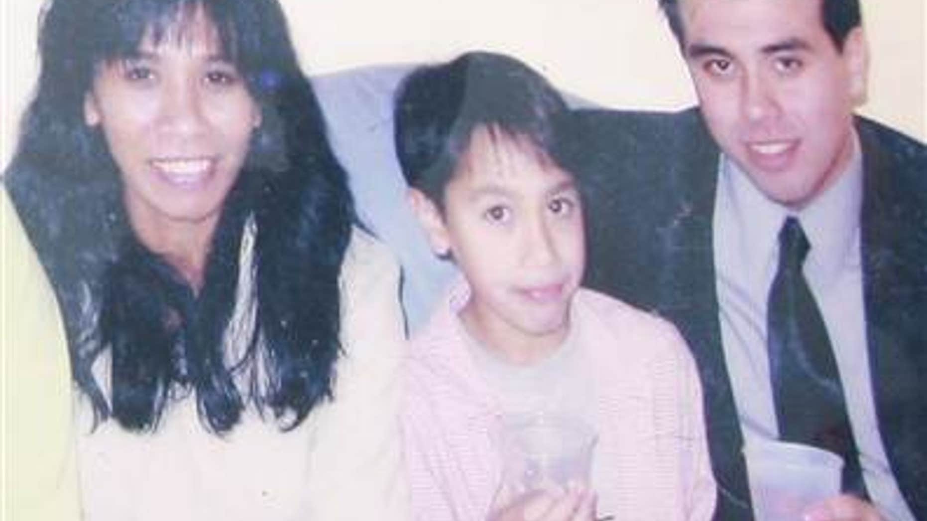 A family photo shows Gerfa Yeatts Lunsmann, left, and her son Kevin Eric Lunsmann, with Gerfa's unidentified husband.