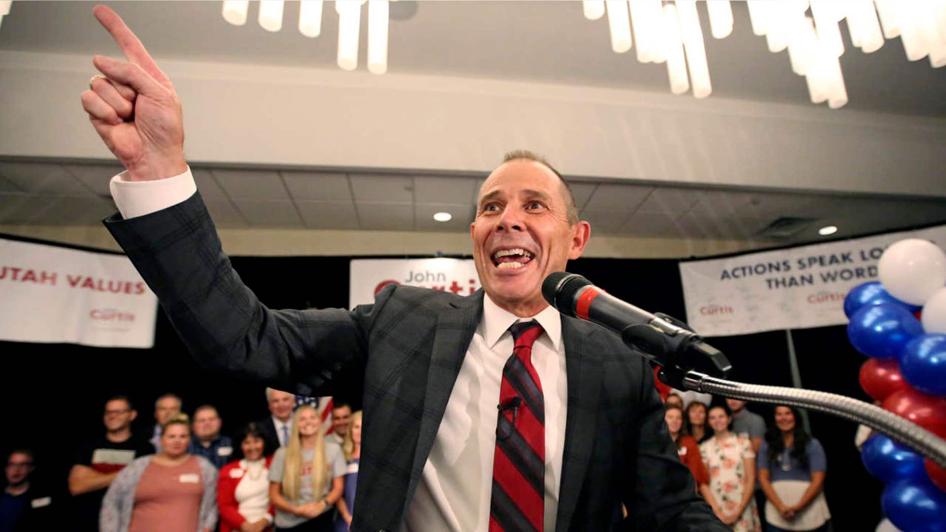 FILE - In this Aug. 15, 2017, file photo, Provo Mayor John Curtis celebrates after winning Utah's Republican primary to become the favorite to fill the U.S.