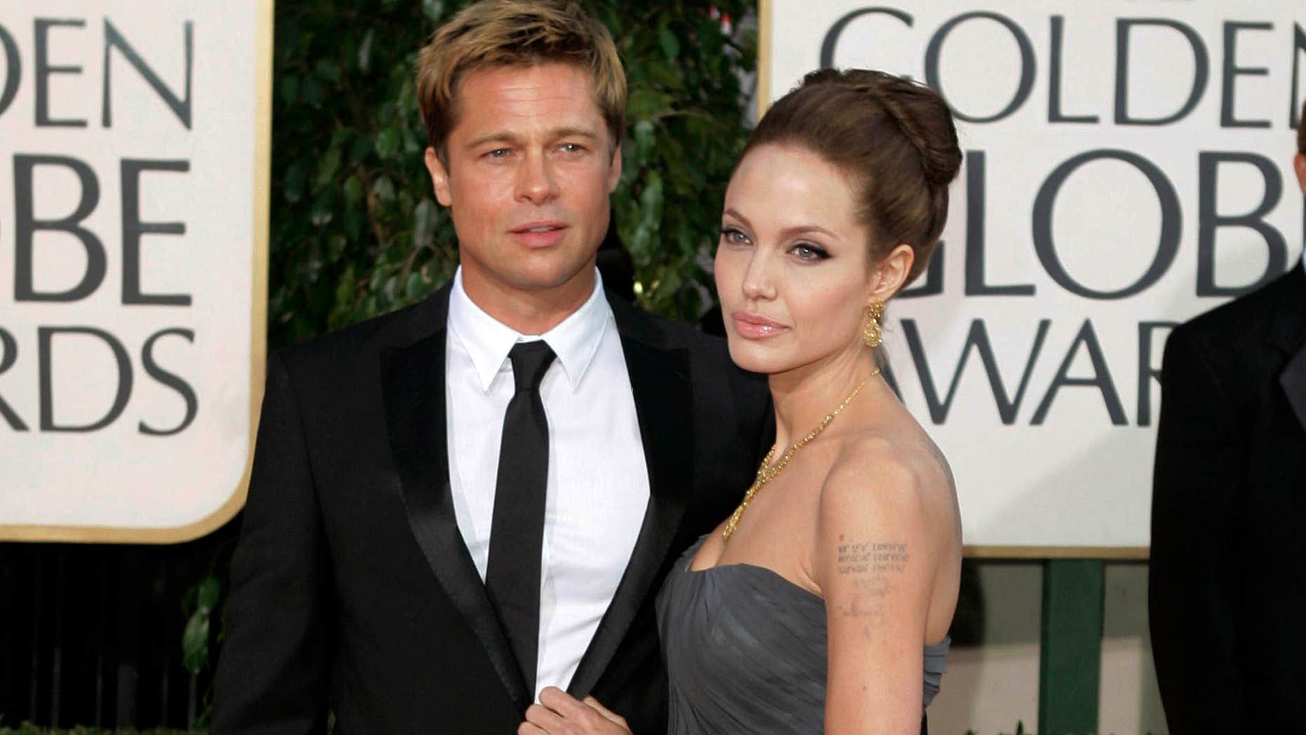 FILE - In this Jan. 15, 2007, file photo, actor Brad Pitt and actress Angelina Jolie arrive for the 64th Annual Golden Globe Awards in Beverly Hills, Calif.