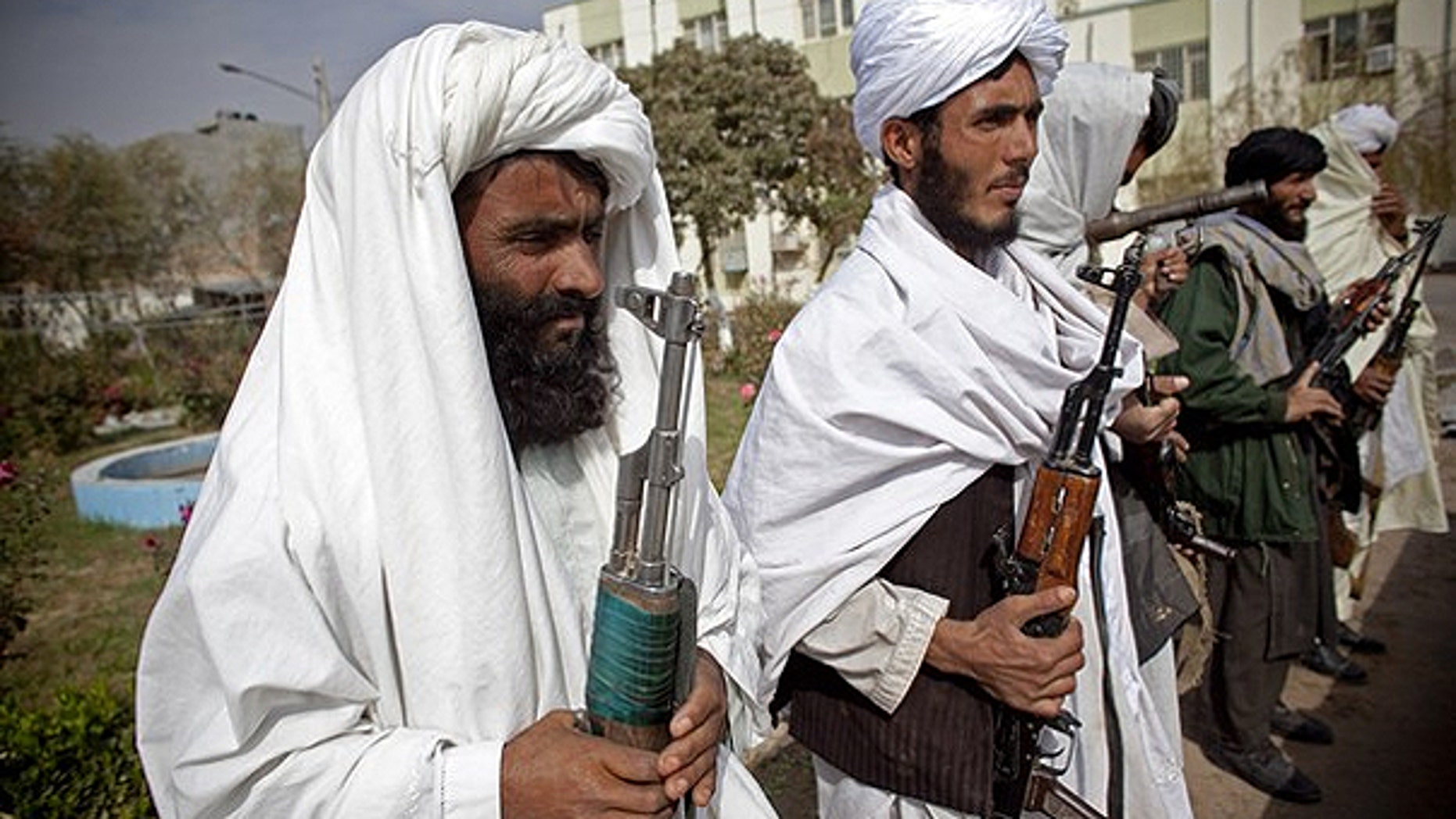 Nov. 4: Surrendering Taliban militants stand with their weapons as they are presented to the media in Herat, Afghanistan.