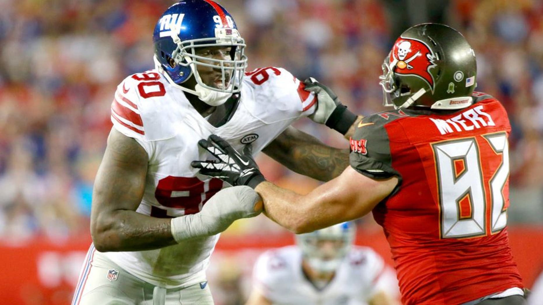 Nov 8, 2015; Tampa, FL, USA; New York Giants defensive end Jason Pierre-Paul (90) rushes as Tampa Bay Buccaneers tight end Brandon Myers (82) blocks during the second half at Raymond James Stadium. New York Giants defeated the Tampa Bay Buccaneers 32-18. Mandatory Credit: Kim Klement-USA TODAY Sports