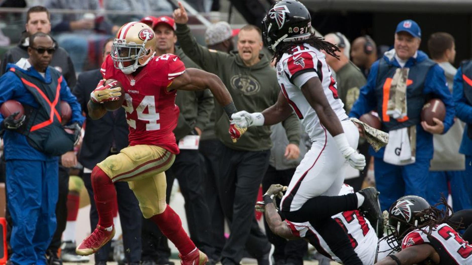 Nov 8, 2015; Santa Clara, CA, USA; San Francisco 49ers running back Shaun Draughn (24) carries the ball against the Atlanta Falcons during the second quarter at Levi's Stadium. Mandatory Credit: Kelley L Cox-USA TODAY Sports