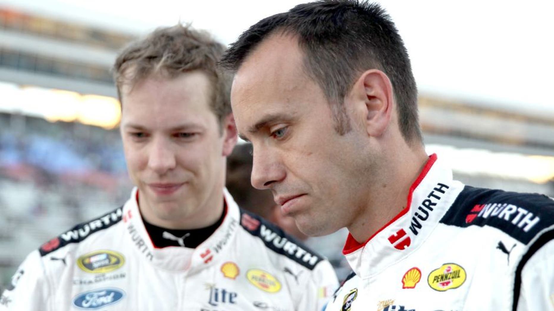FORT WORTH, TX - NOVEMBER 08: Brad Keselowski (L), driver of the #2 Wurth Ford, talks to crew chief Paul Wolfe after placing second behind Jimmie Johnson, driver of the #48 Lowe's Chevrolet, during the NASCAR Sprint Cup Series AAA Texas 500 at Texas Motor Speedway on November 8, 2015 in Fort Worth, Texas. (Photo by Chris Graythen/Getty Images for Texas Motor Speedway)