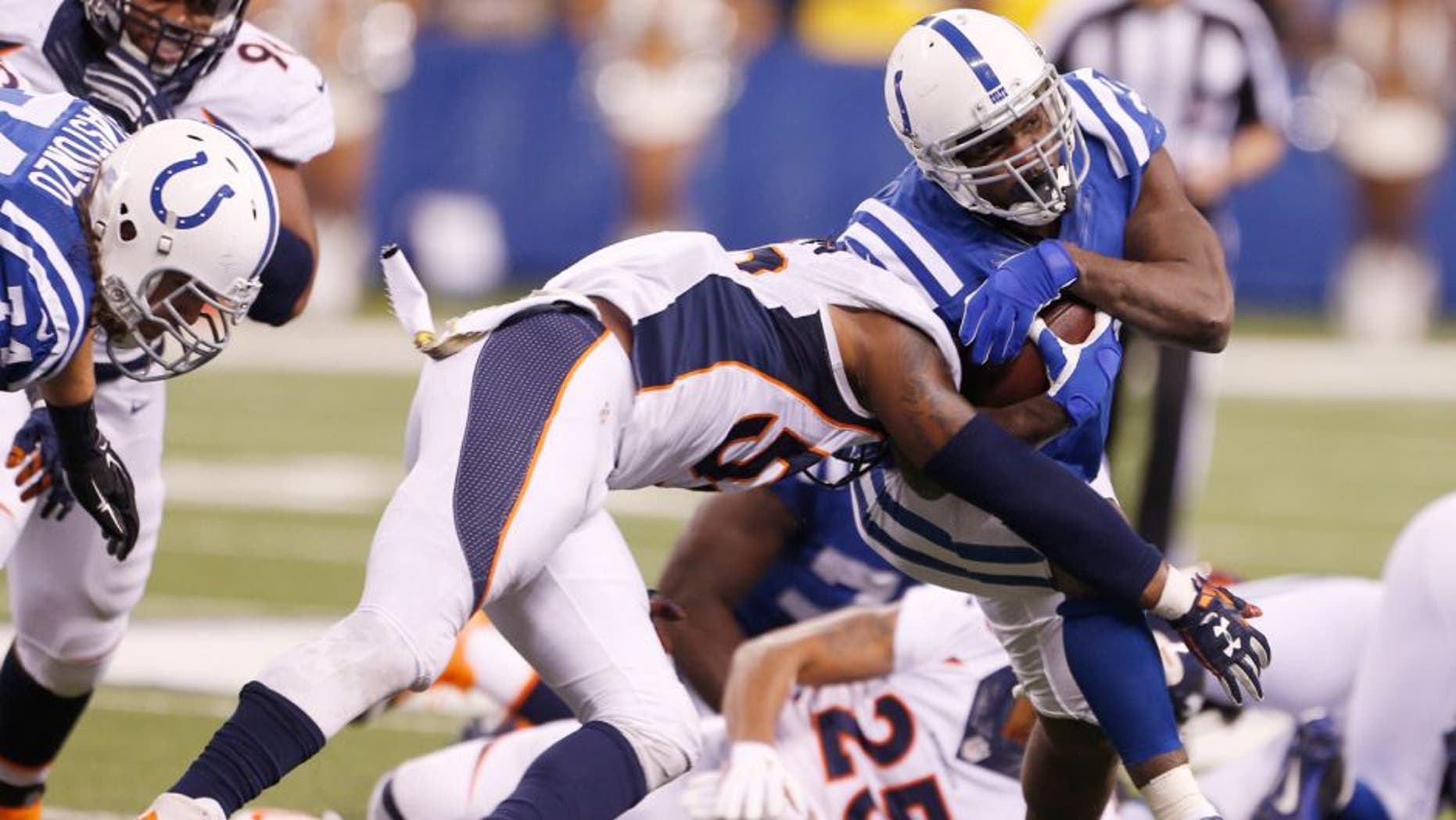 Nov 8, 2015; Indianapolis, IN, USA; Indianapolis Colts running back Frank Gore (23) runs with the ball against the Denver Broncos at Lucas Oil Stadium. Indianapolis defeats Denver 27-24. Mandatory Credit: Brian Spurlock-USA TODAY Sports