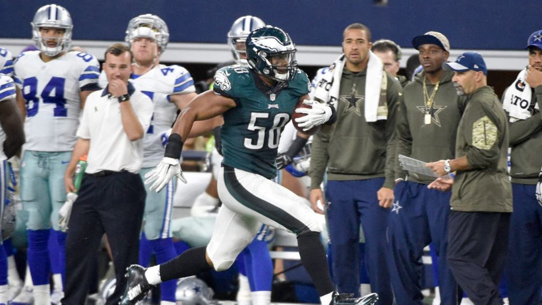 Philadelphia Eagles' Jordan Hicks (58) runs back an interception from the Dallas Cowboys for a touchdown in the second half of an NFL football game, Sunday, Nov. 8, 2015, in Arlington, Texas. (AP Photo/Michael Ainsworth)