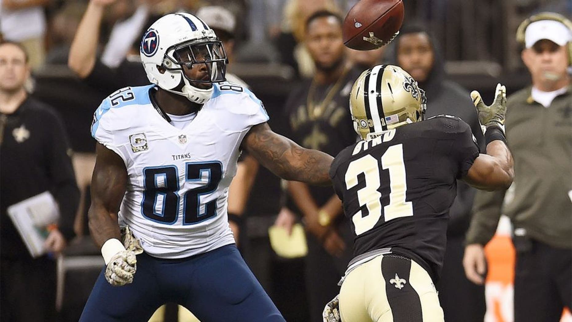 NEW ORLEANS, LA - NOVEMBER 08: Delanie Walker #82 of the Tennessee Titans and Jairus Byrd #31 of the New Orleans Saints reach for a loose ball during the second quarter of a game at the Mercedes-Benz Superdome on November 8, 2015 in New Orleans, Louisiana. (Photo by Stacy Revere/Getty Images)