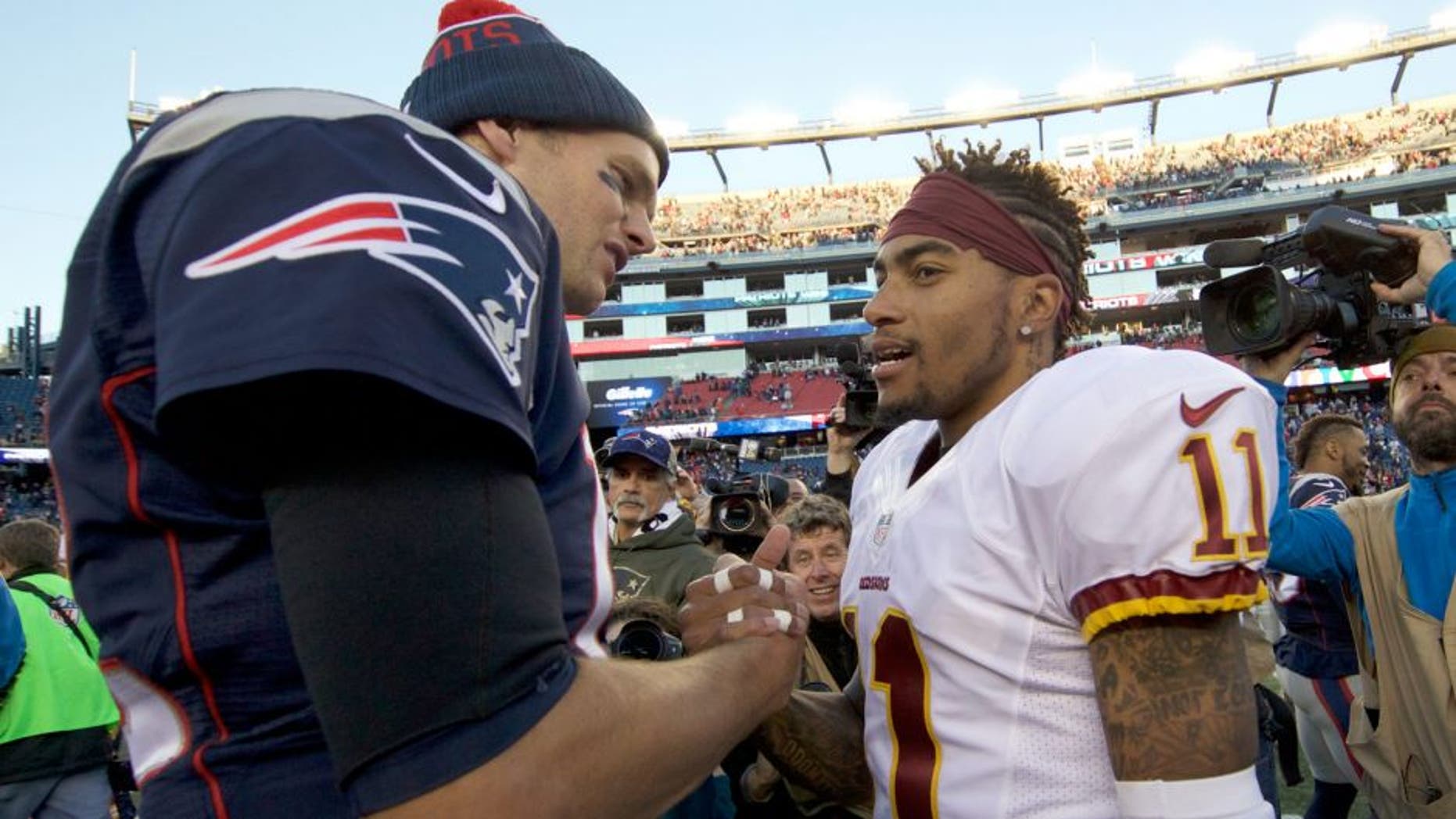 Nov 8, 2015; Foxborough, MA, USA; New England Patriots quarterback Tom Brady (12) greets Washington Redskins wide receiver DeSean Jackson (11) after the game at Gillette Stadium. The Patriots defeated the Redskins 27-10. Mandatory Credit: David Butler II-USA TODAY Sports