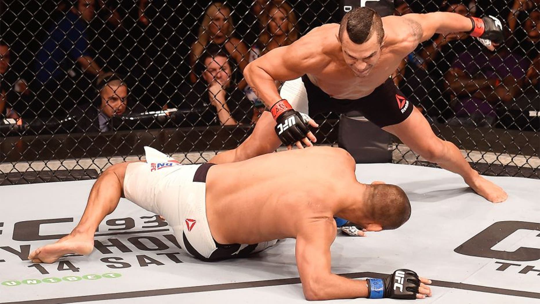 SAO PAULO, BRAZIL - NOVEMBER 07: Vitor Belfort of Brazil punches Dan Henderson of the United States in their middleweight bout during the UFC Fight Night Belfort v Henderson on November 7, 2015 in Sao Paulo, Brazil. (Photo by Buda Mendes/Zuffa LLC/Zuffa LLC via Getty Images)