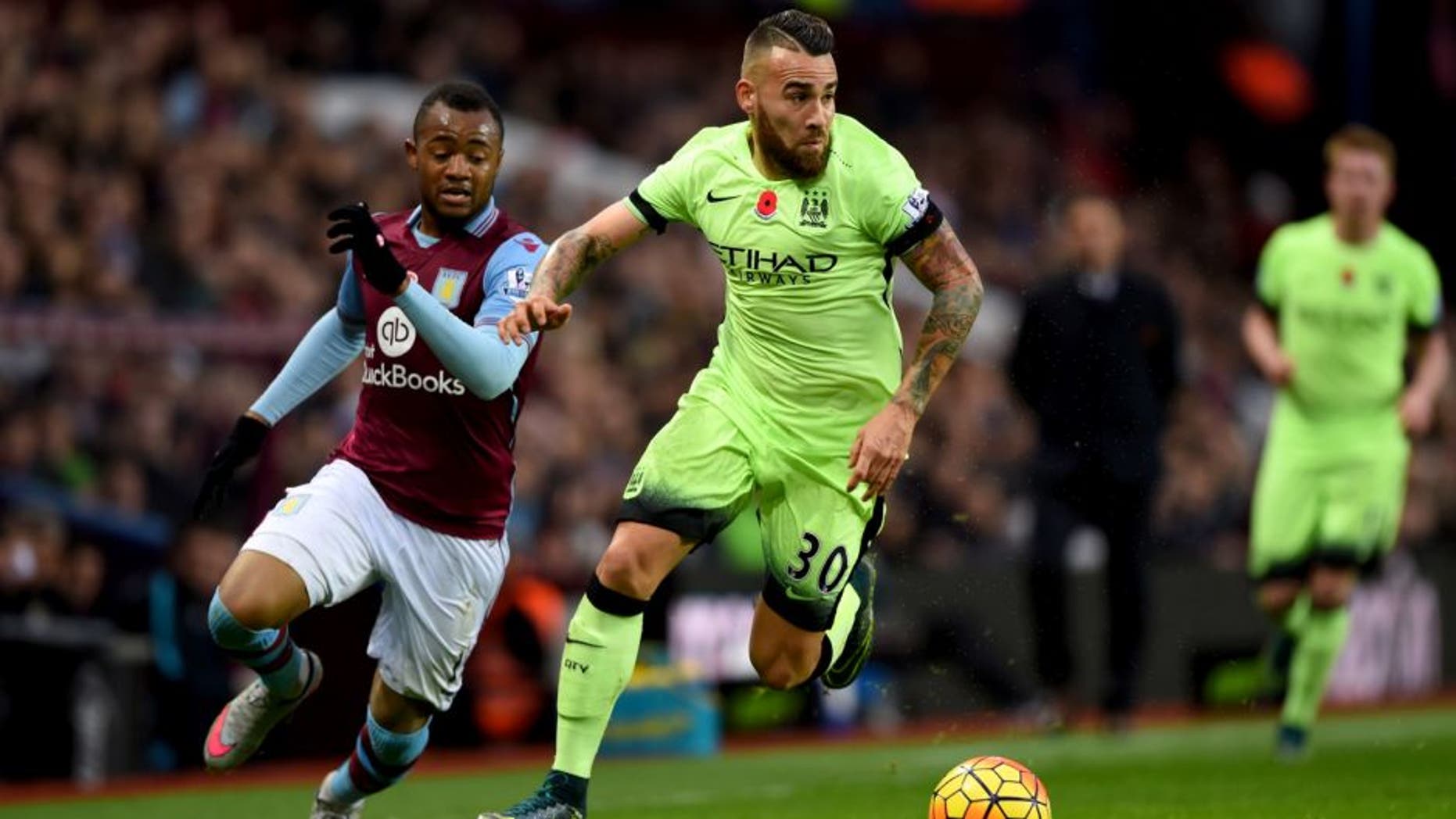BIRMINGHAM, ENGLAND - NOVEMBER 08: Nicolas Otamendi of Manchester City holds off Jordan Ayew of Aston Villa during the Barclays Premier League match between Aston Villa and Manchester City at Villa Park on November 8, 2015 in Birmingham, England. (Photo by Shaun Botterill/Getty Images)