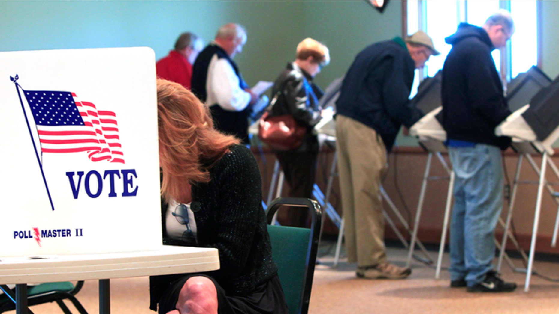 Nov. 6, 2012: A steady stream of voters fill the voting booths at Ronald Reagan Lodge in West Chester, Ohio.